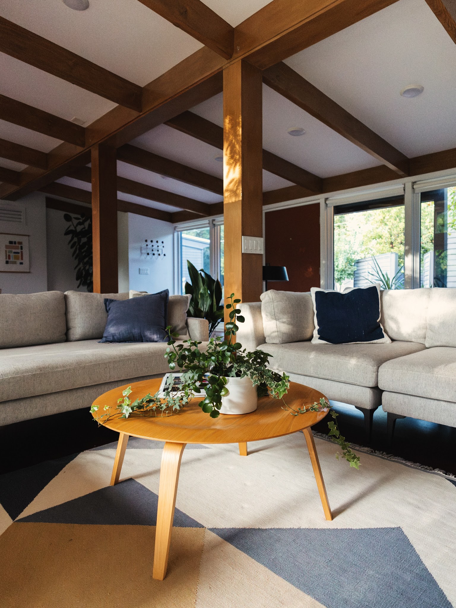 5. Soften Exposed Beams with Low Pale Seating
