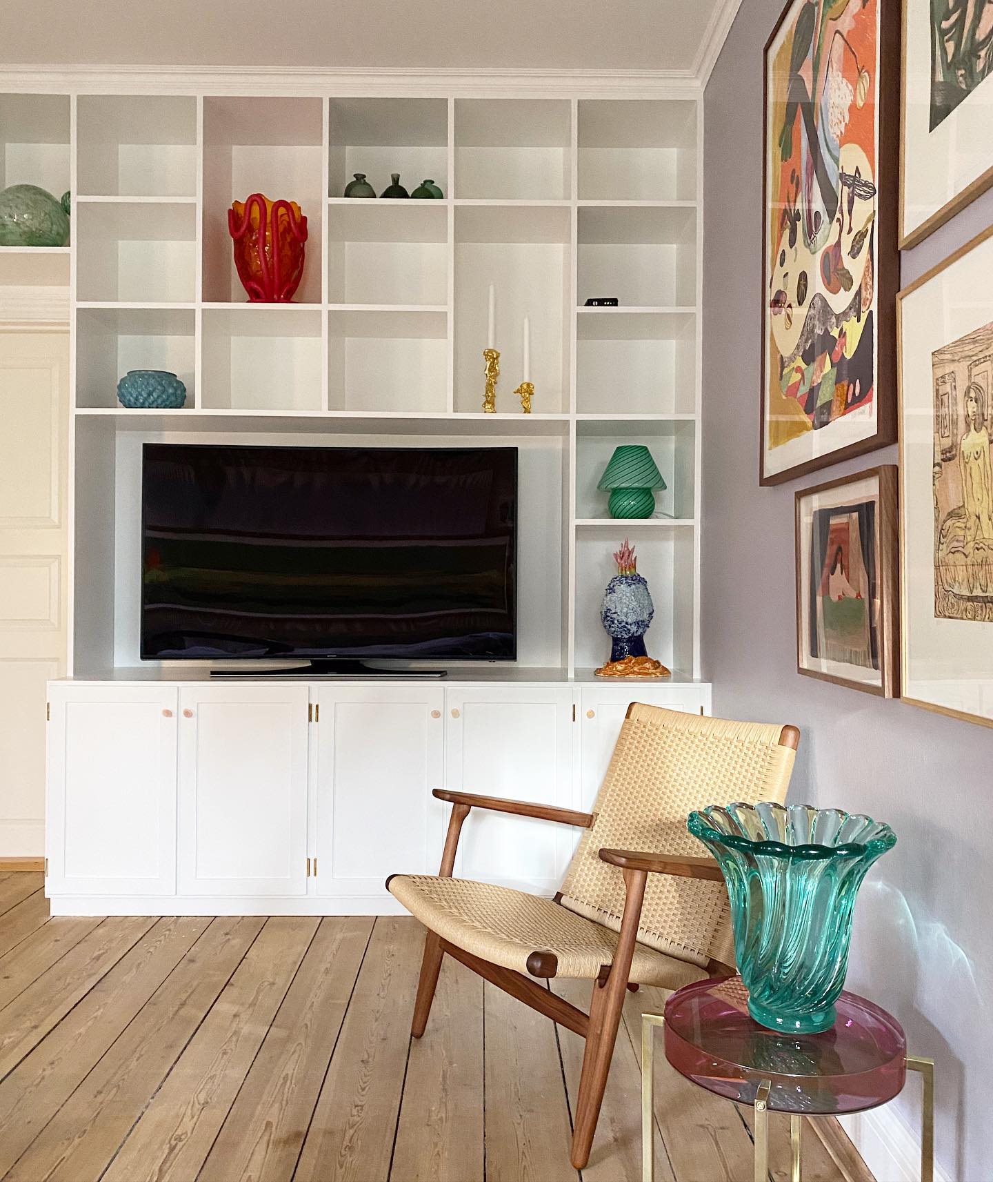 9. Display Colored Glass Beside a Woven Chair