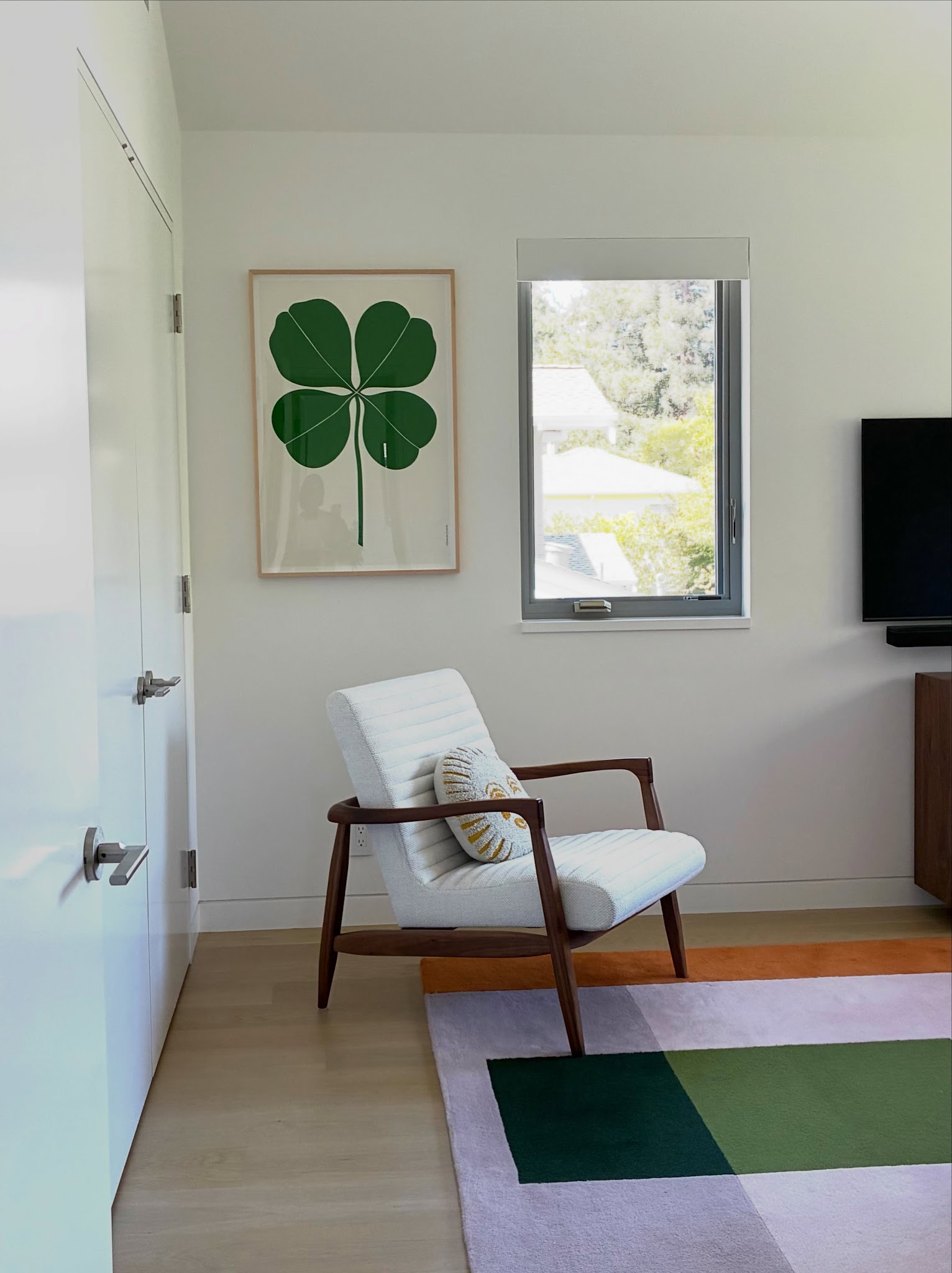 20. Pair a Bold Graphic Print with a Simple Armchair
