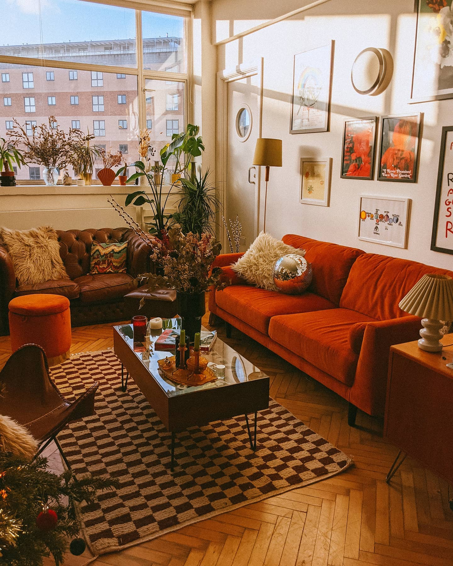 4. Anchor a Bright Room With an Orange Sofa