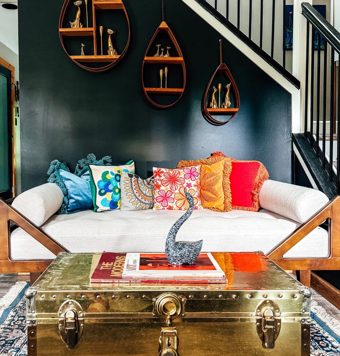 6. Show Colorful Cushions Against a Dark Green Wall