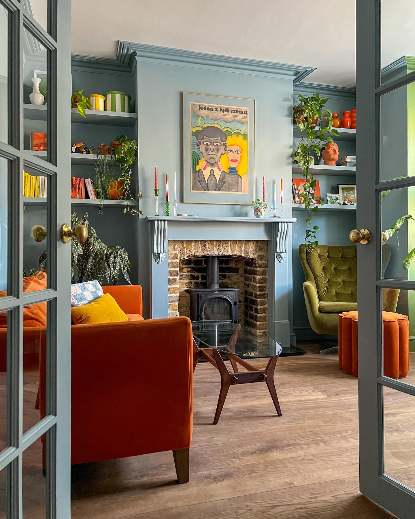18. Balance Orange Seating With Soft Blue Walls