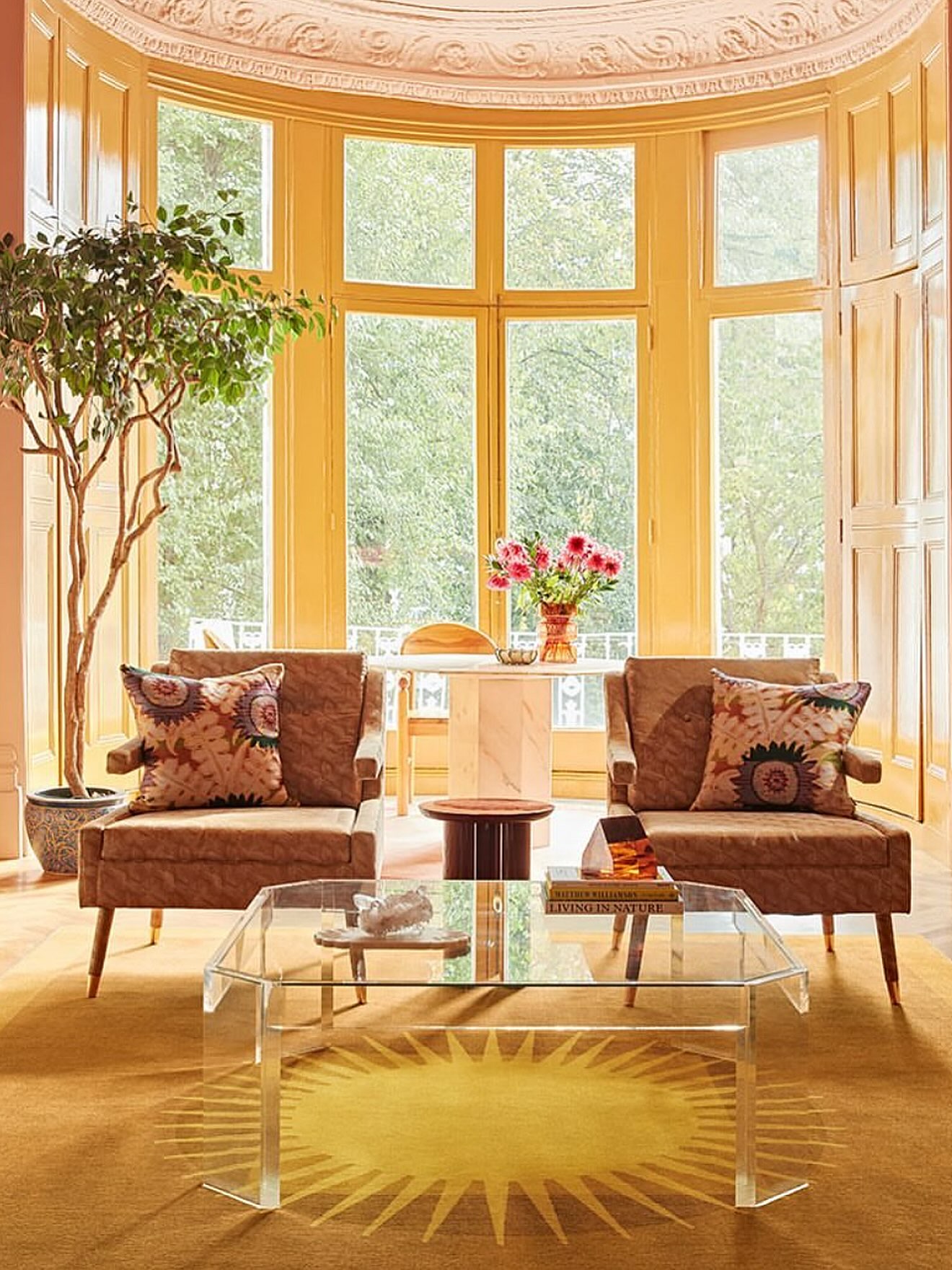 8. Let Clear Furniture Show Off a Graphic Rug