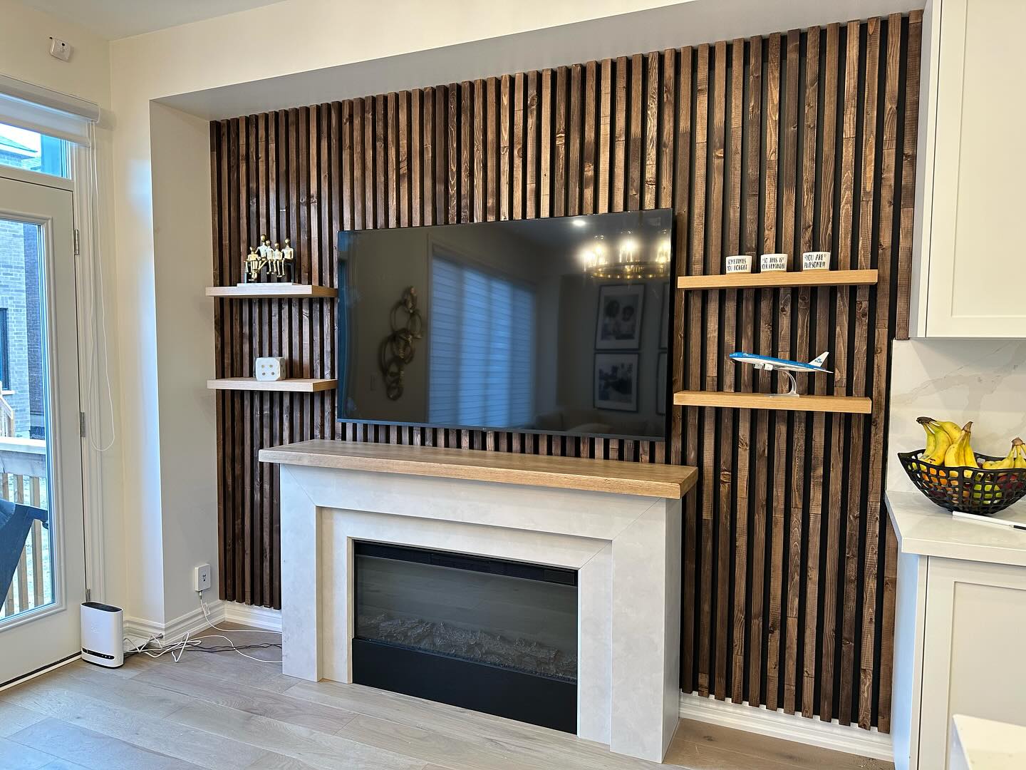 8. Dark Slats Around a Pale Fireplace