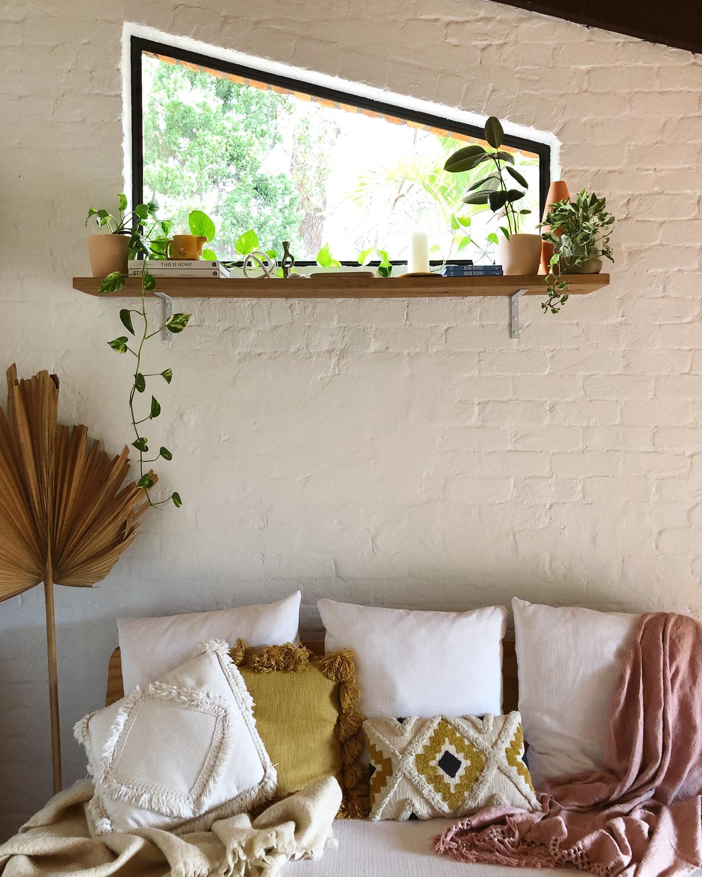 16. Let Pale Brick Texture Define the Sofa Wall
