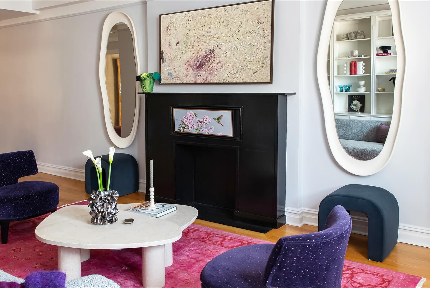 8. Frame the Fireplace With Oversized Oval Mirrors
