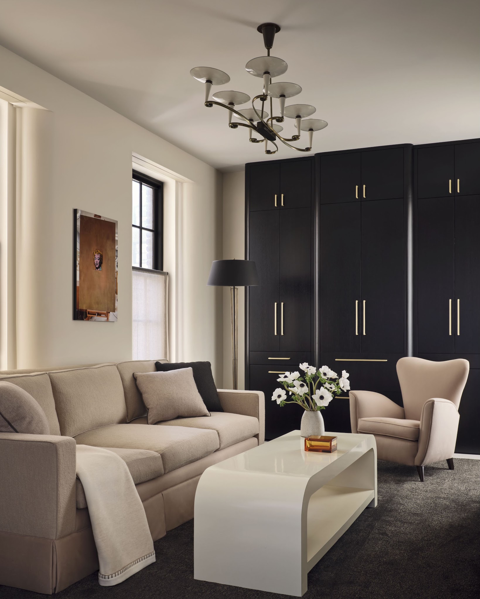 19. Contrast a Glossy Waterfall Table With Dark Storage