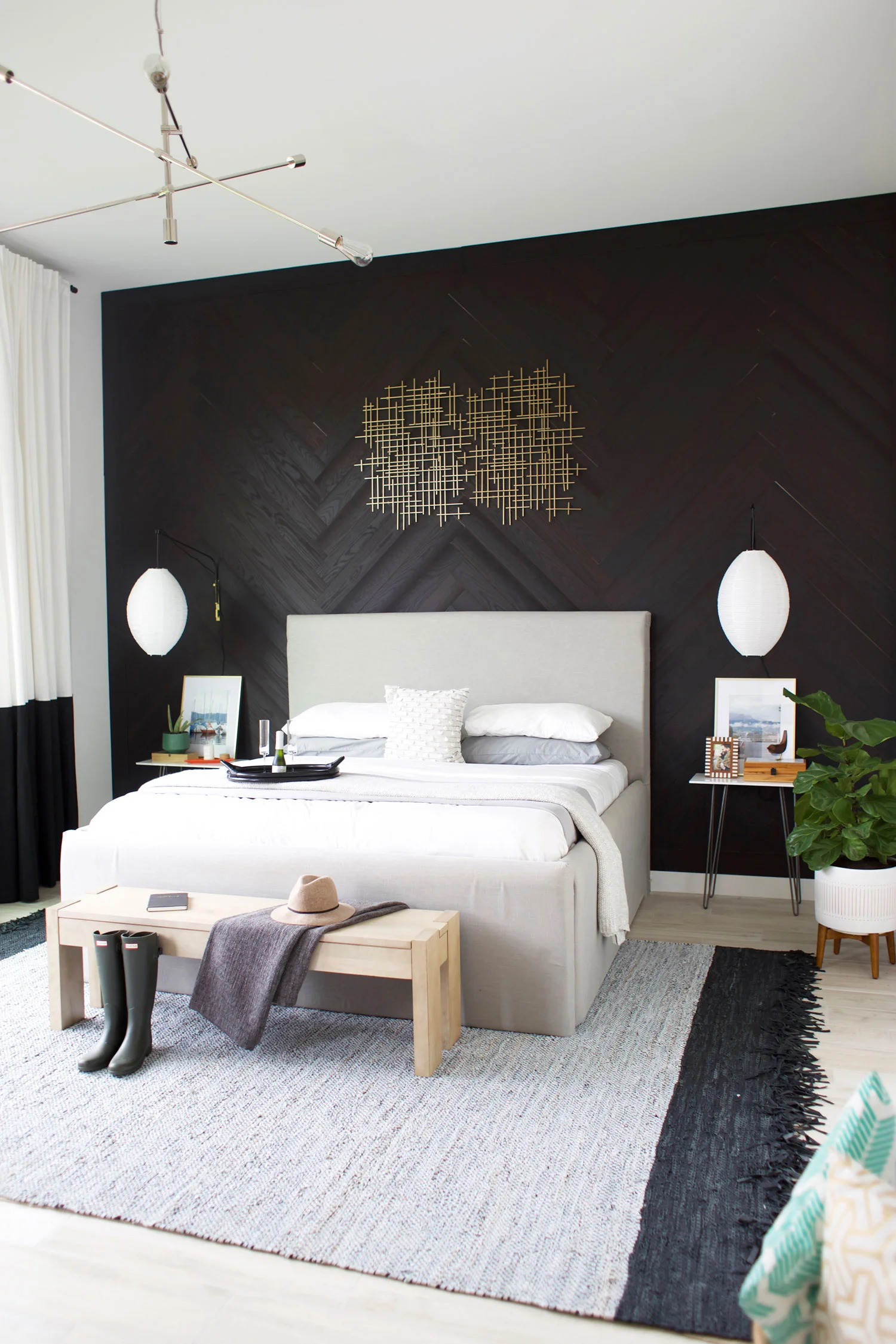 3. Give a Black Accent Wall Direction With Herringbone Boards