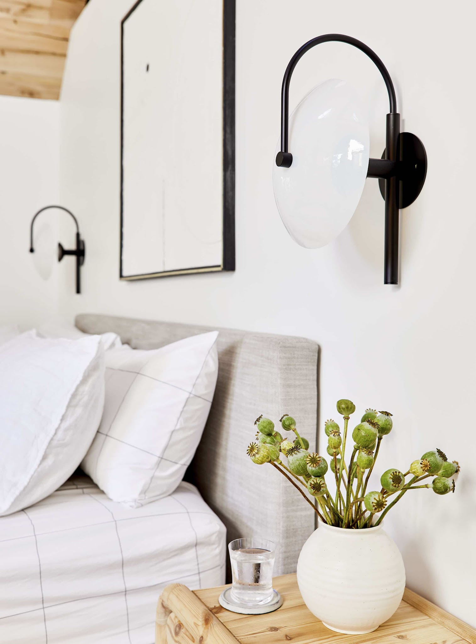 11. Use Sculptural Sconces to Free the Nightstand