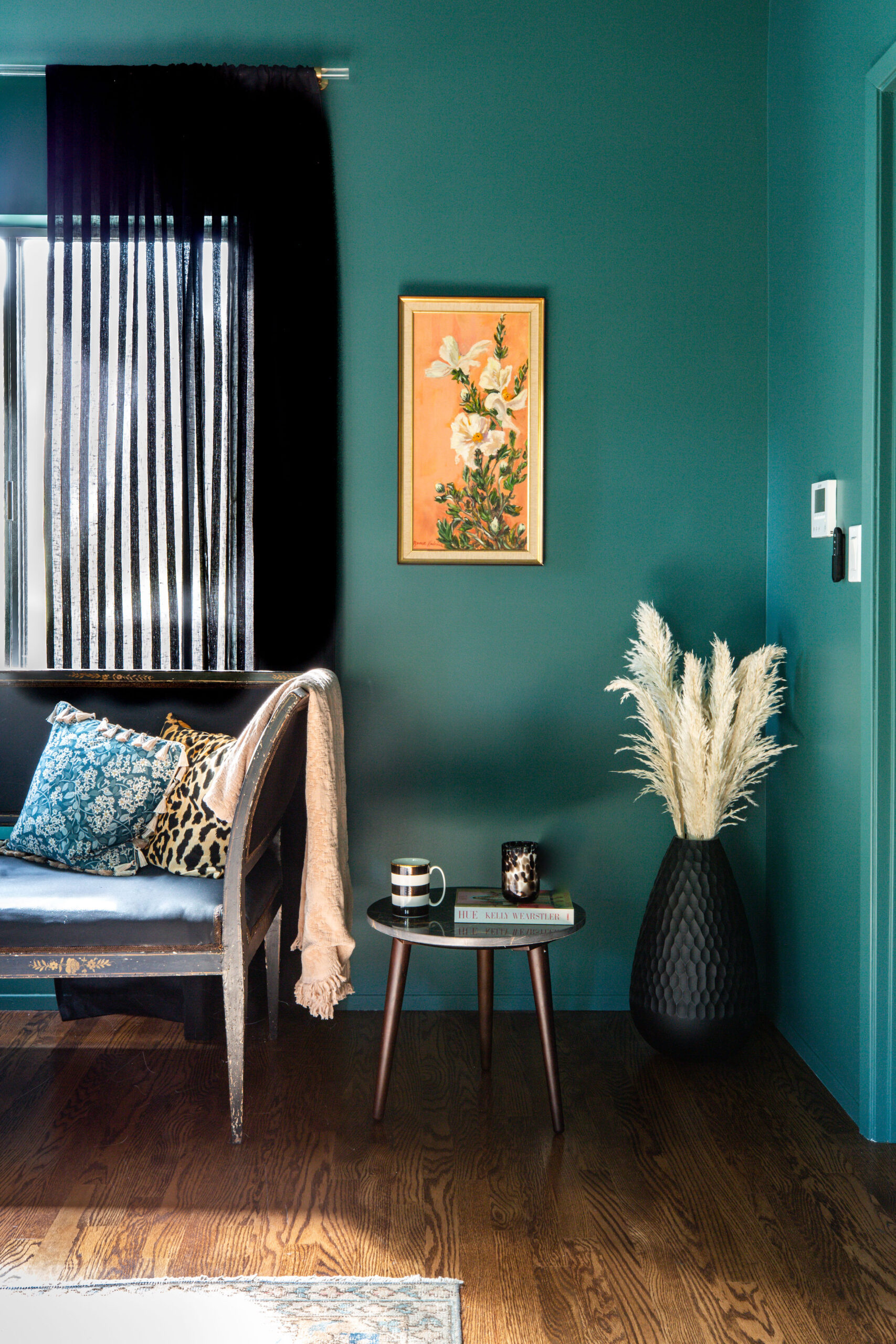19. Give an Antique Seat a Place Against Rich Teal Walls
