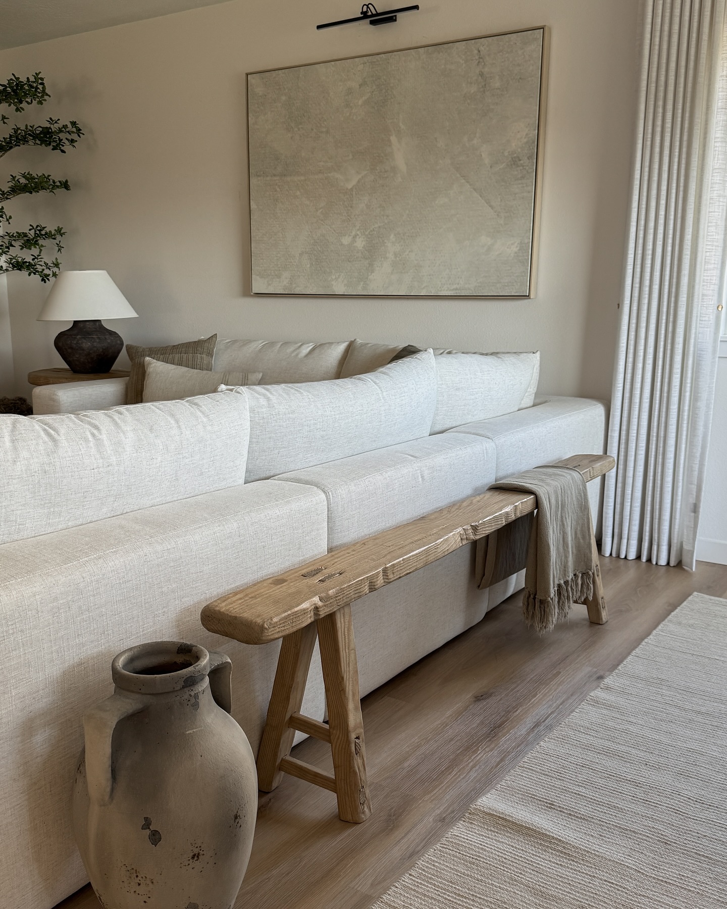 17. Add a Rustic Bench Behind the Sofa