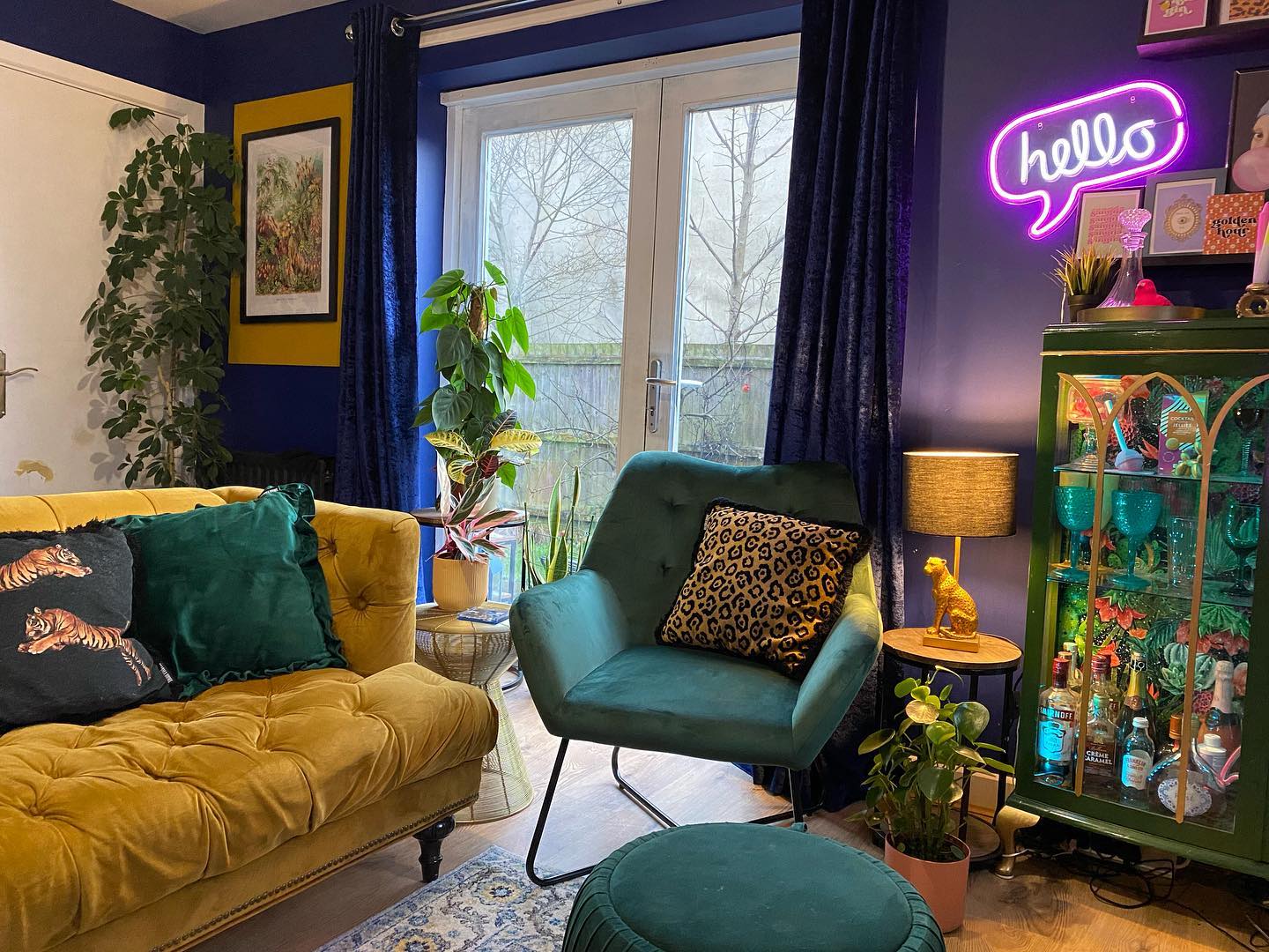 Create a Jewel Toned Lounge with a Glowing Wall Sign
