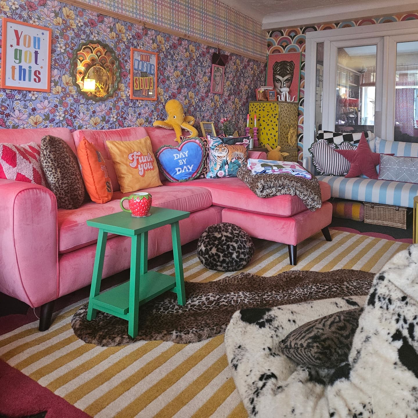 Mix Leopard, Florals, and Stripes Around One Pink Sofa