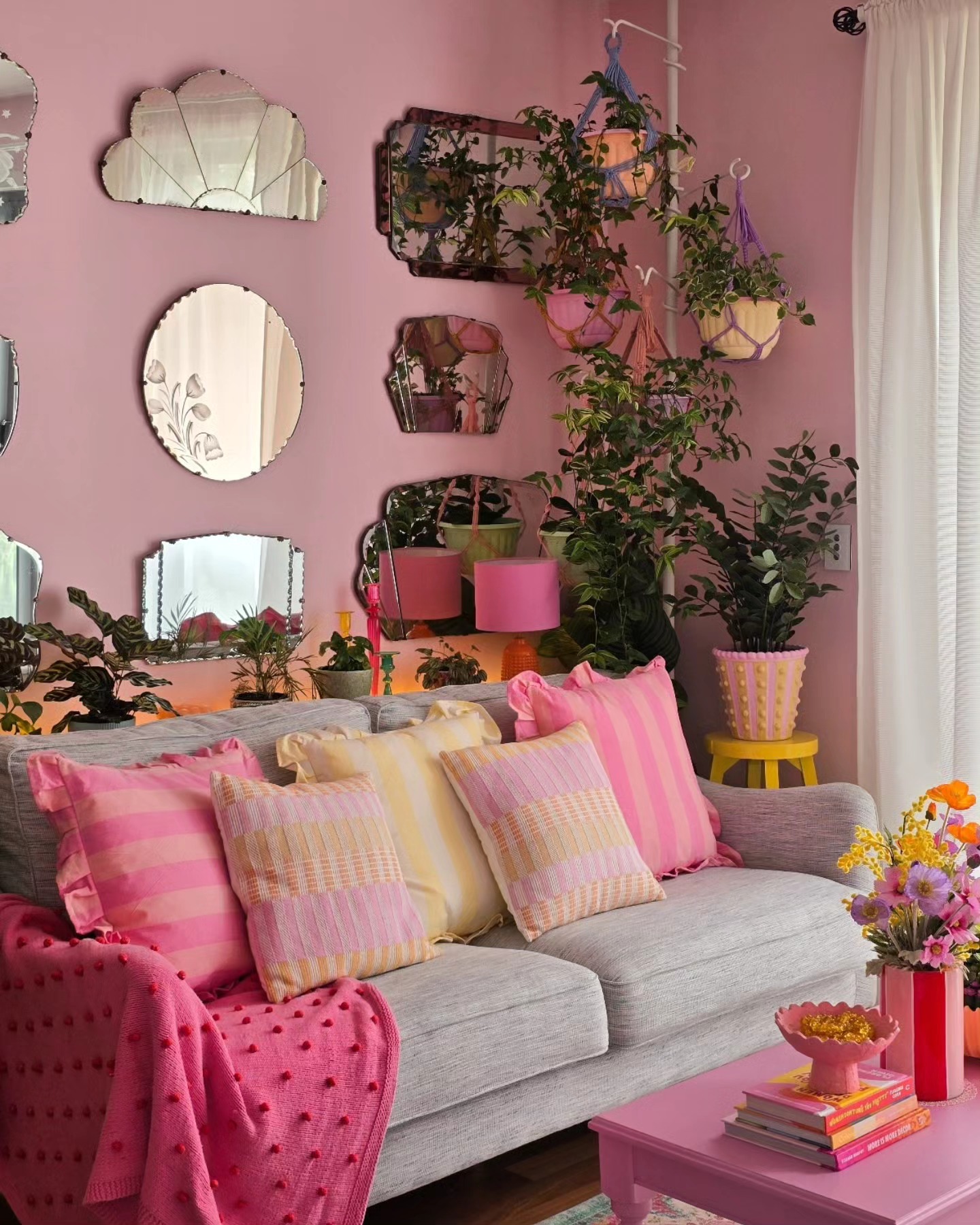 Collect Decorative Mirrors Above a Simple Sofa