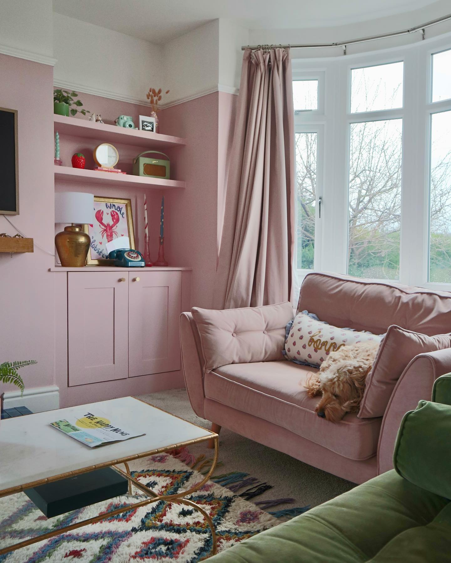 Layer Tonal Pink Around a Gold Framed Coffee Table
