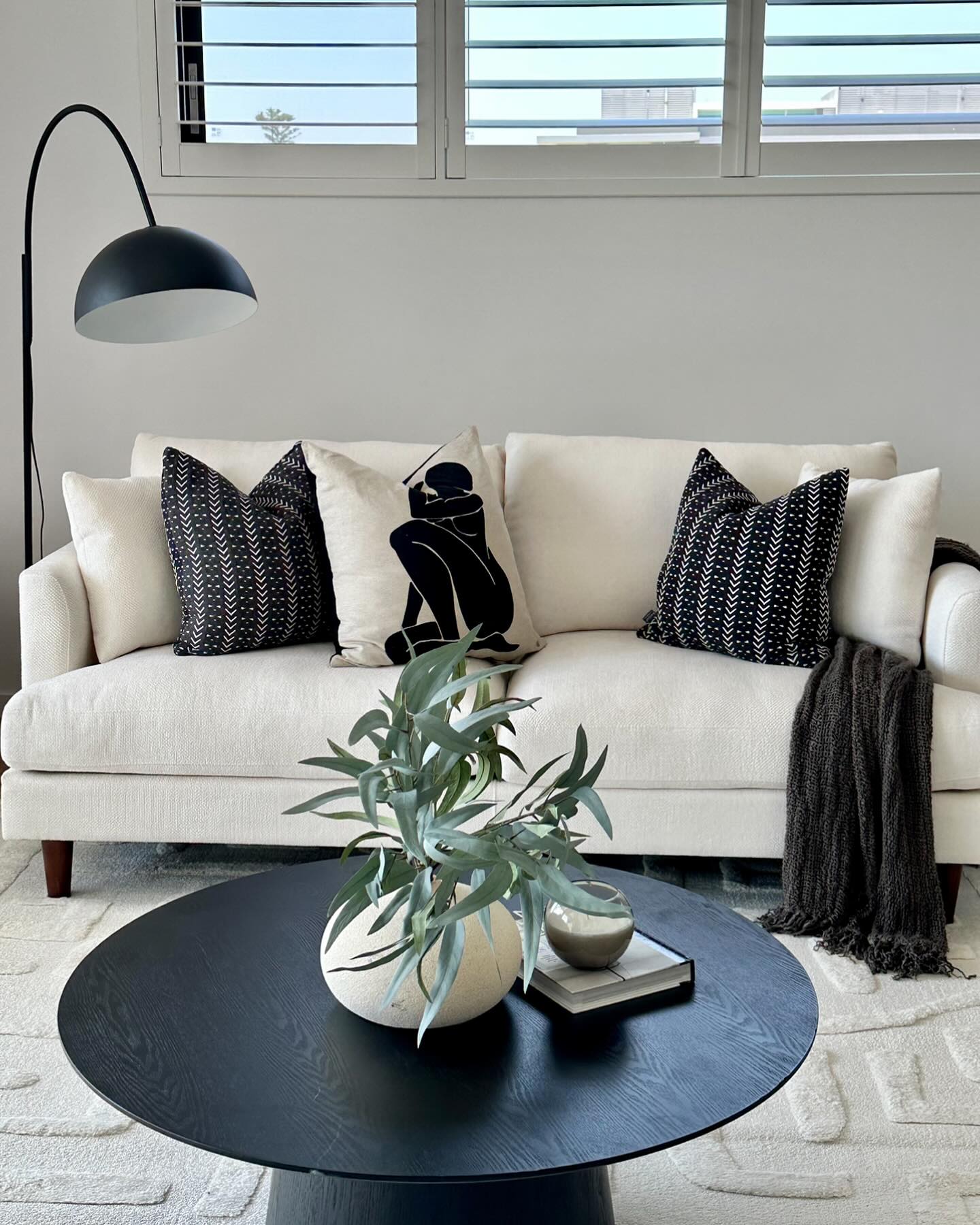 Connect the Seating Area With a Black Arc Lamp