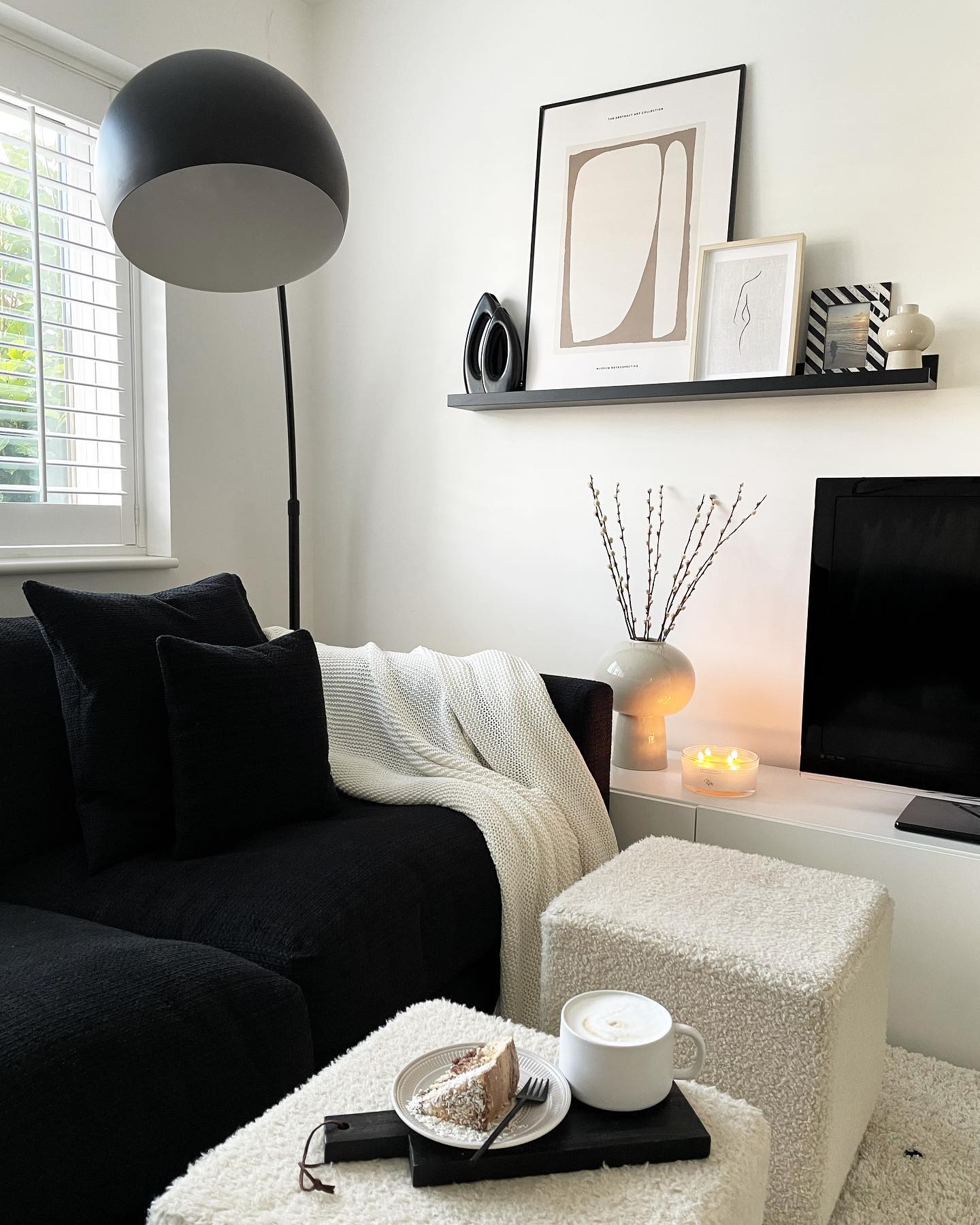 Style a Black Picture Ledge With Pale Art