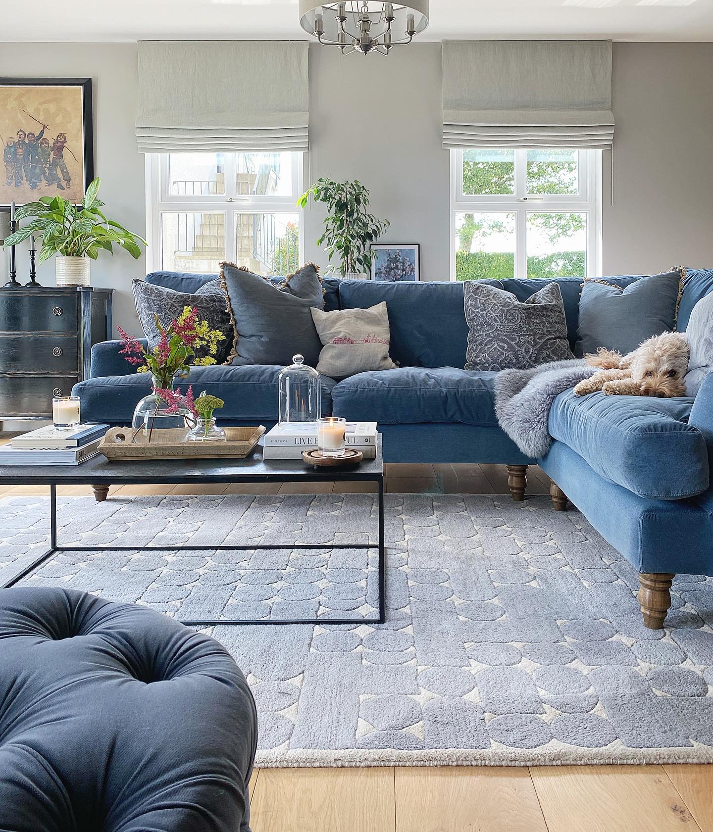 8. Anchor a Blue Sectional with a Patterned Gray Rug