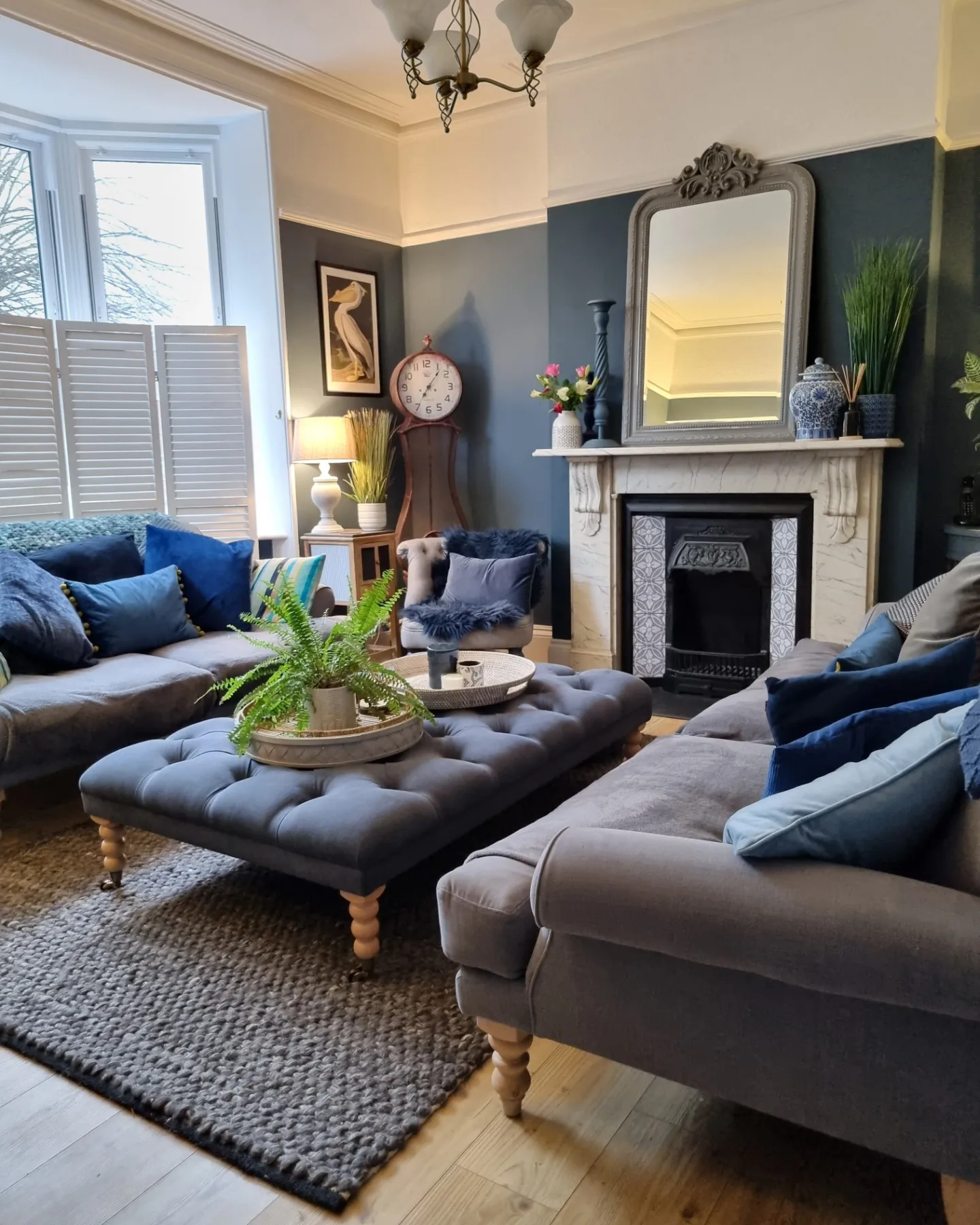 11. Arrange Gray Sofas Around a Shared Ottoman