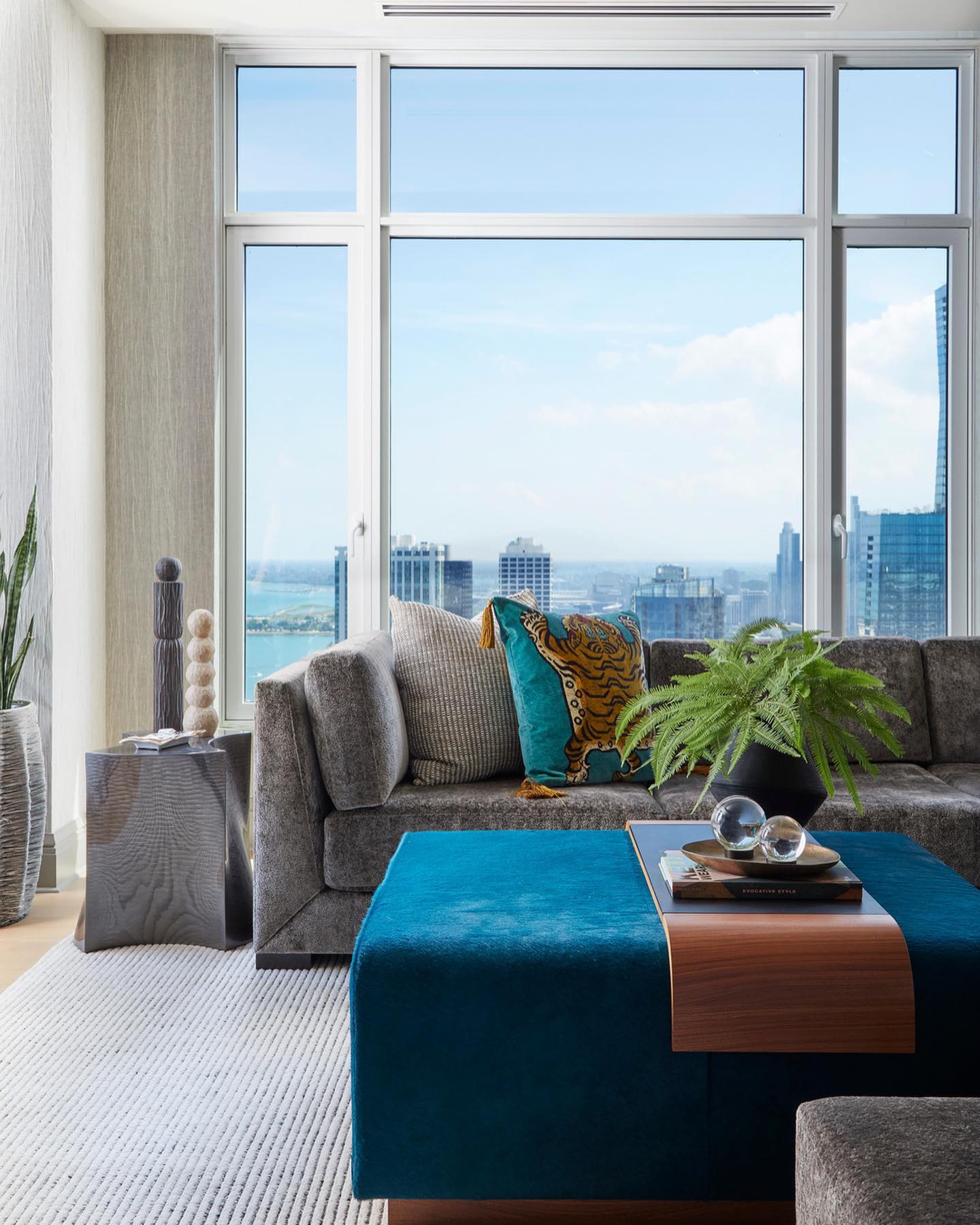 18. Make a Bright Blue Ottoman the Centerpiece