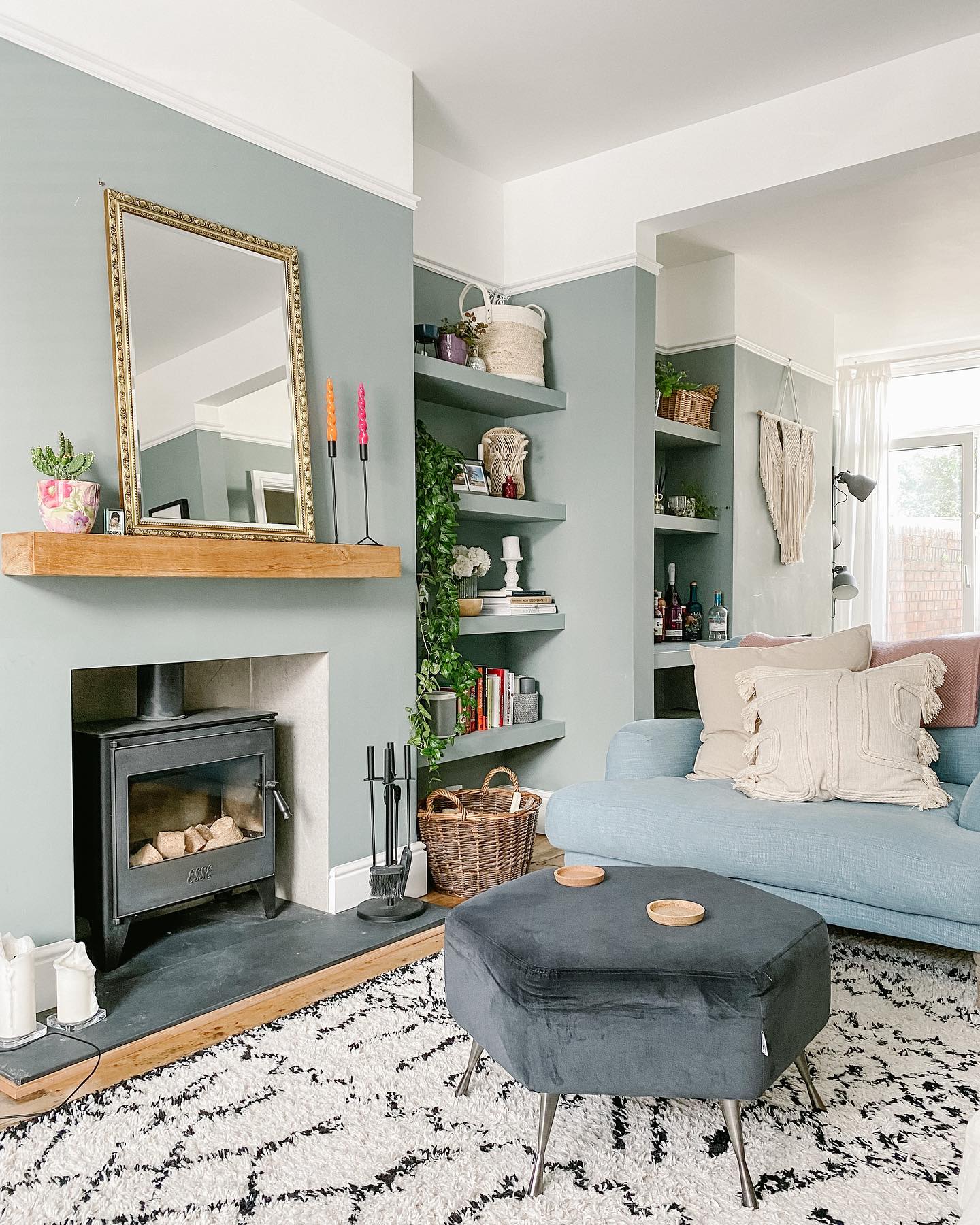 20. Ground a Powder Blue Sofa with Charcoal Gray