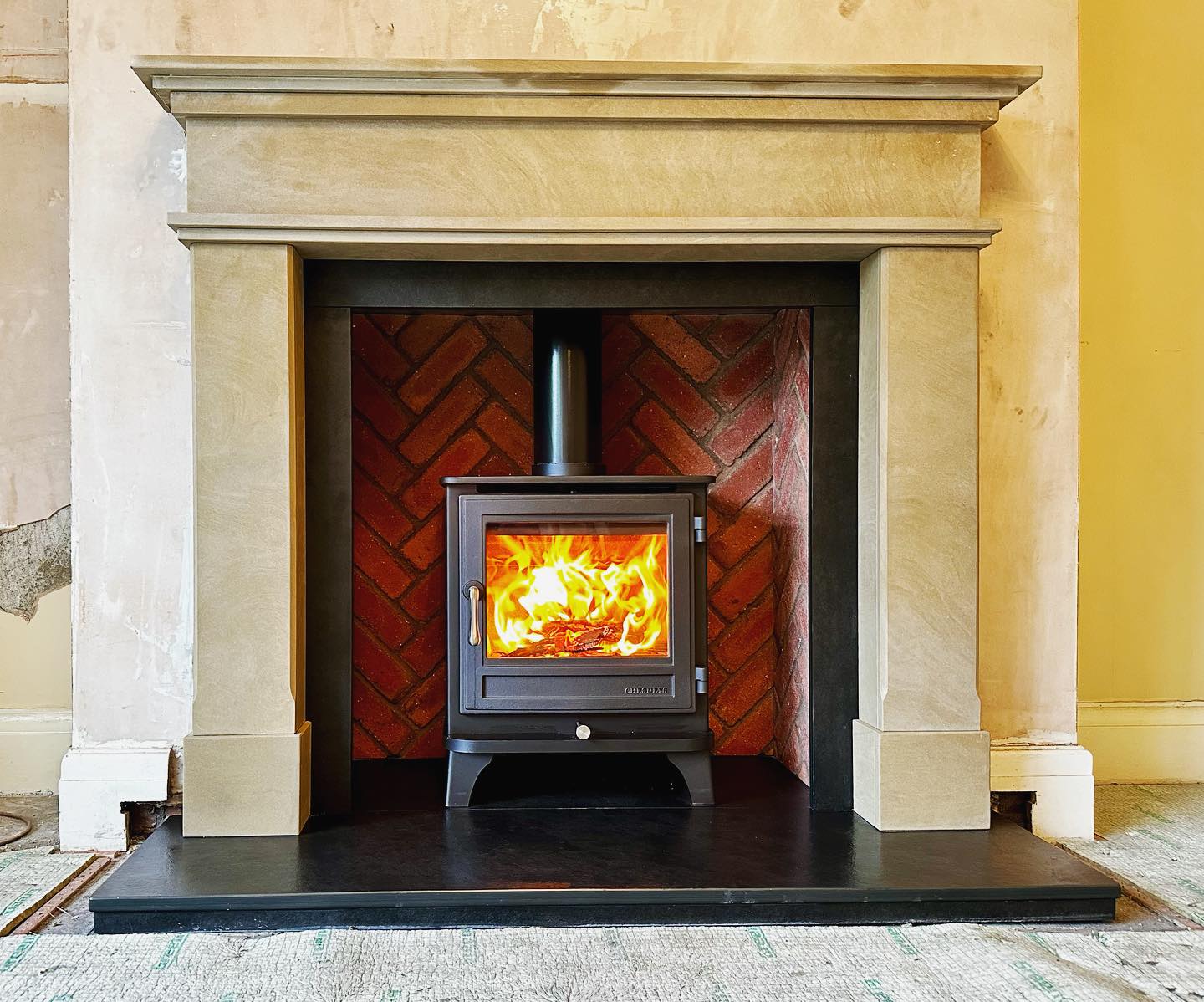 Give a Stove Chamber a Red Herringbone Backdrop