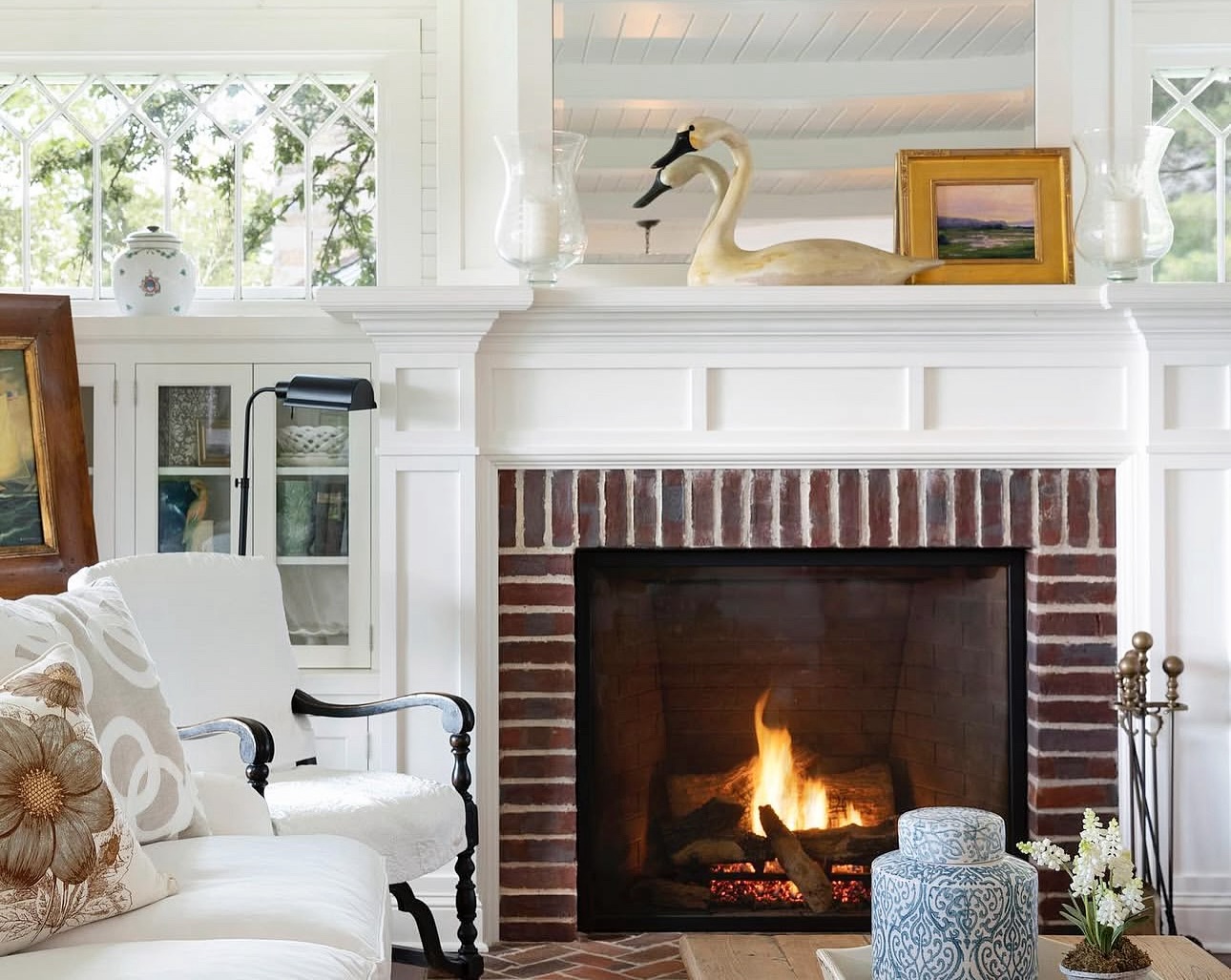 Keep a Red-Brick Fireplace Bright with Glass and Reflection