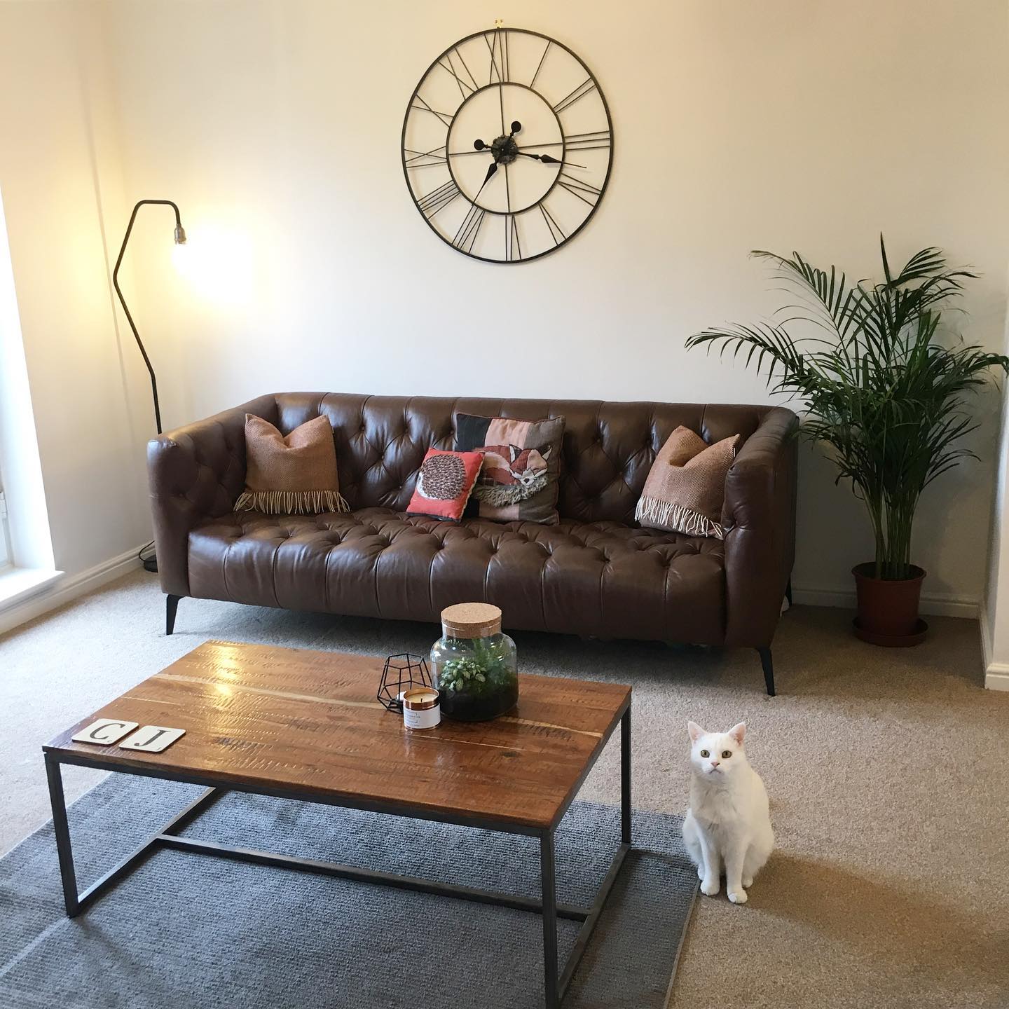 Balance a Tufted Sofa with an Open-Frame Table
