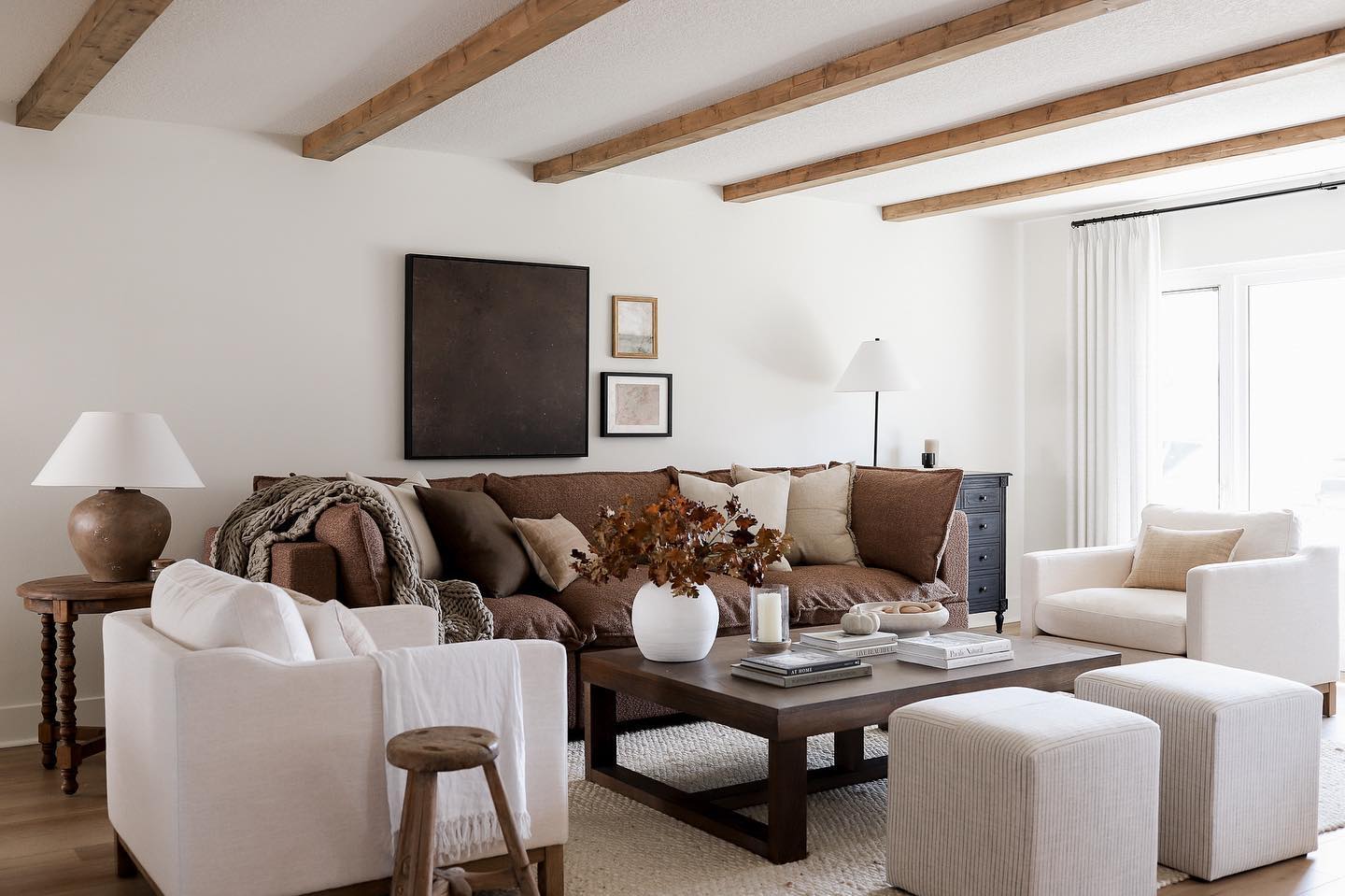 Connect a Brown Sofa to Exposed Wood Beams
