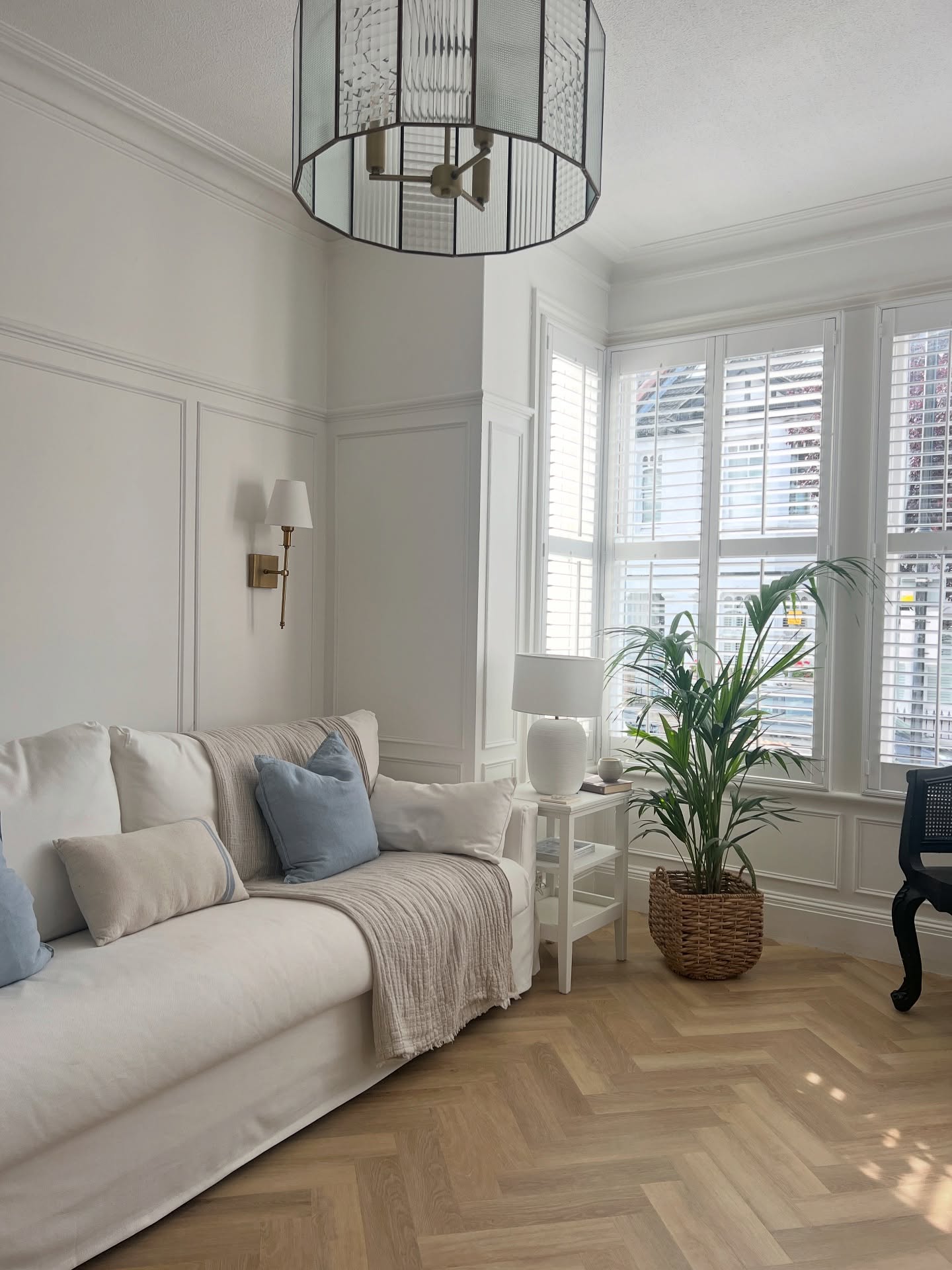 Add Coastal Softness to a Paneled Bay Window Room