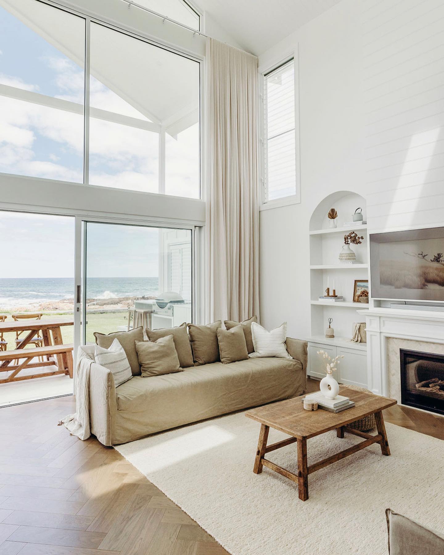 Soften Tall Glass with Full Height Neutral Curtains