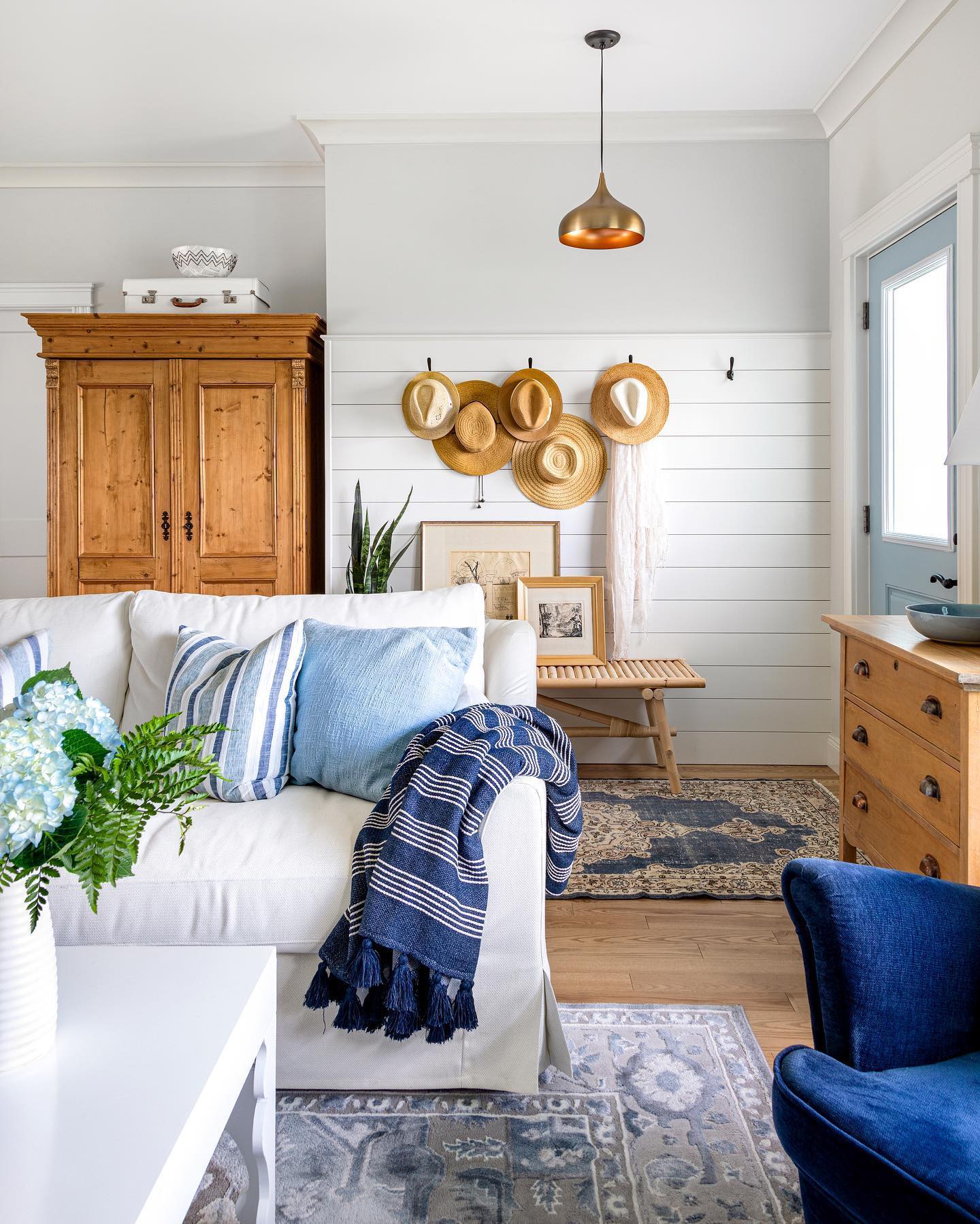 Warm a Blue and White Room with Wood Storage