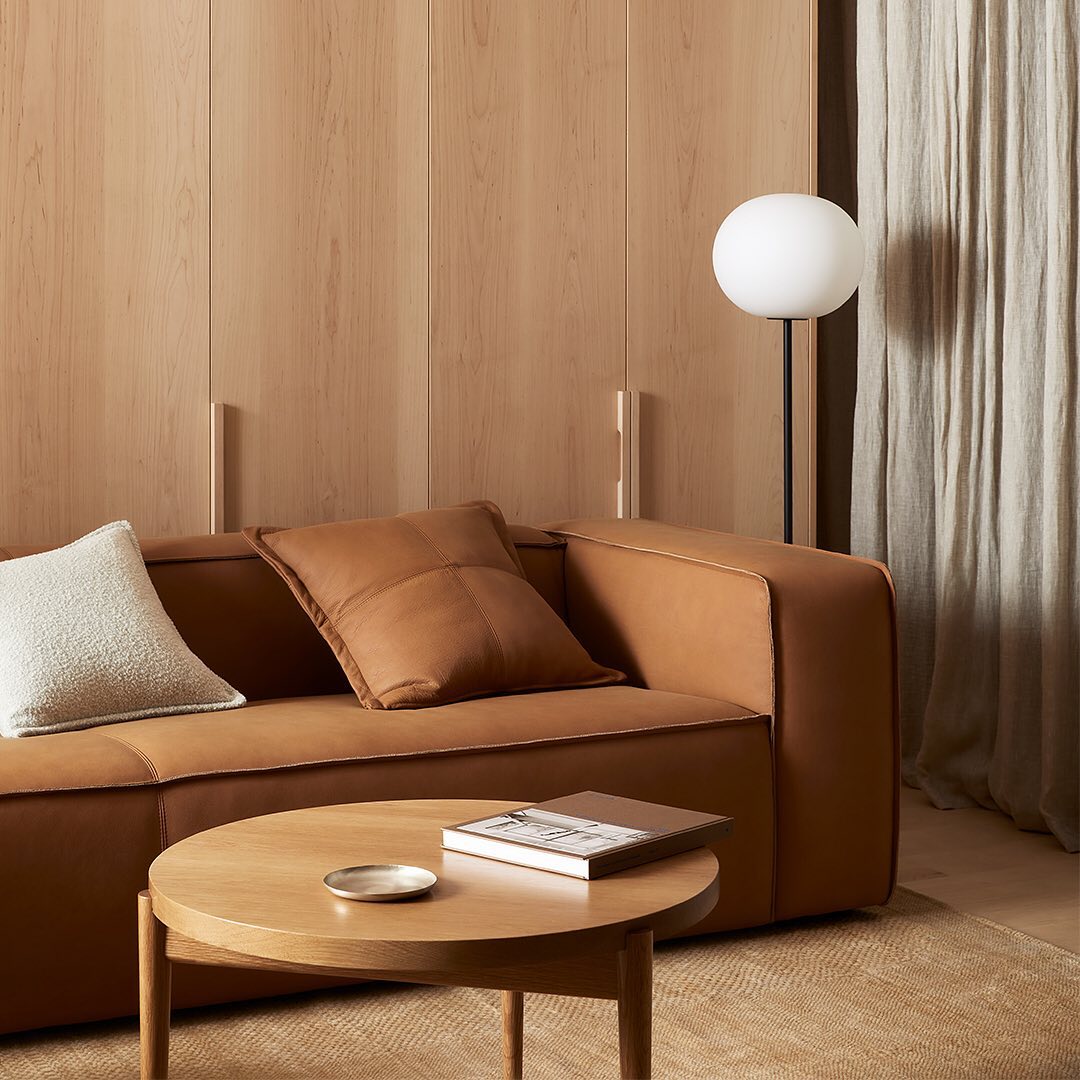 4. Pair Cognac Leather With Pale Wood Paneling