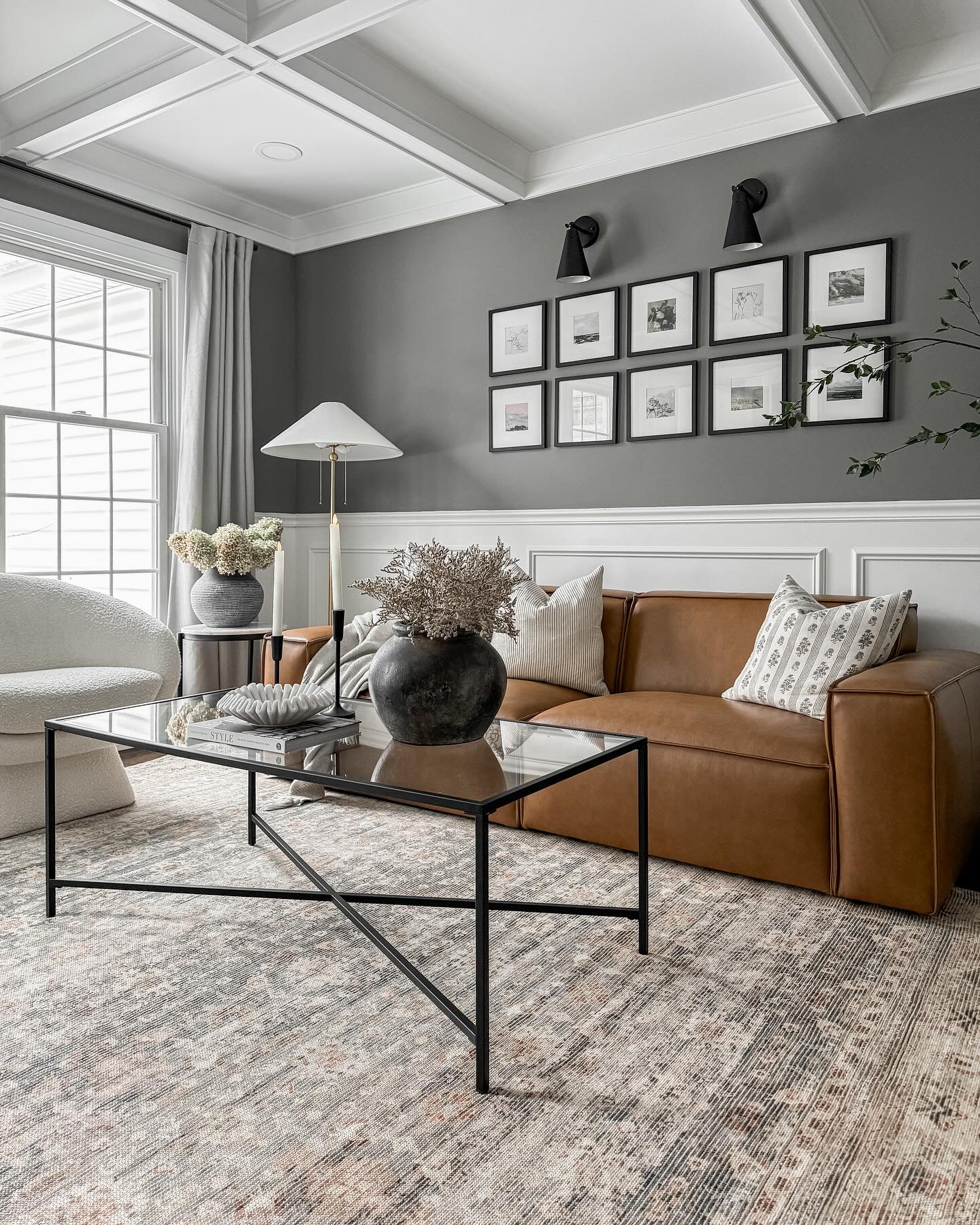16. Frame a Cognac Sofa With Gray Walls and White Paneling