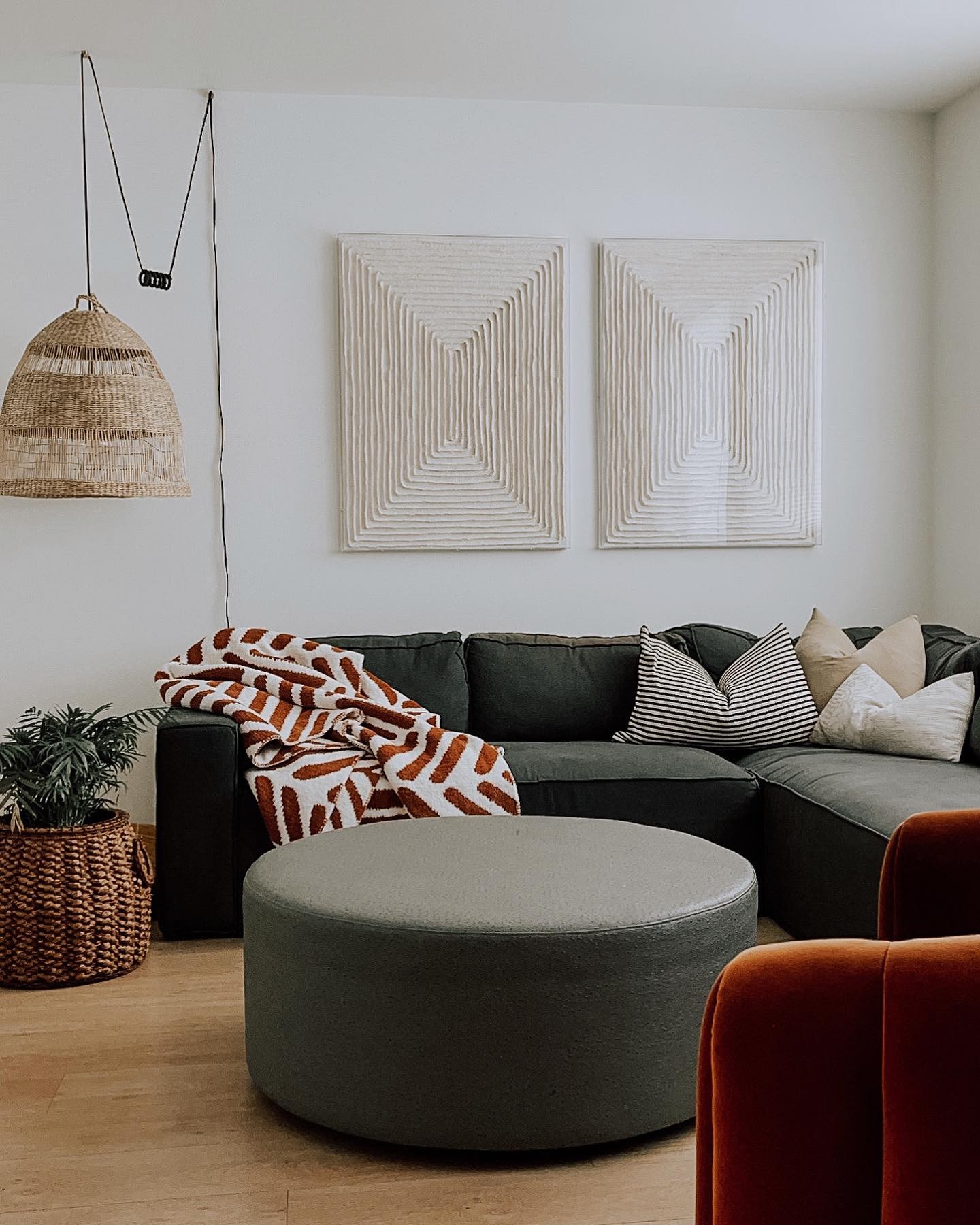 Soften a Boxy Sectional with a Round Ottoman