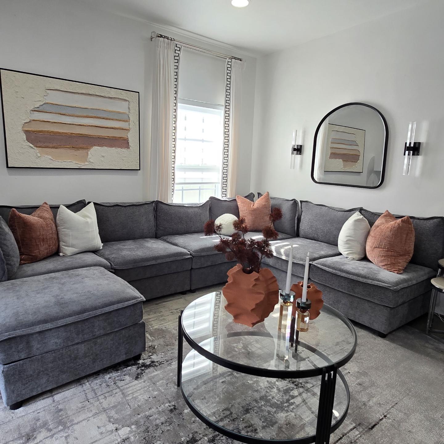 Repeat Terracotta Accents Across Art and Pillows