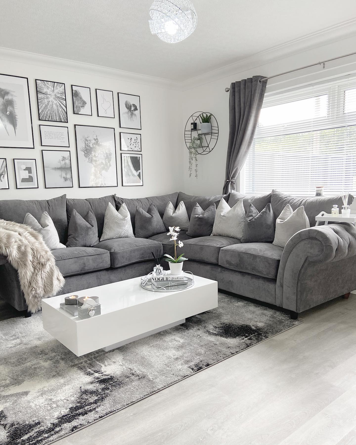 Build a Black-and-White Gallery Above a Gray Sectional