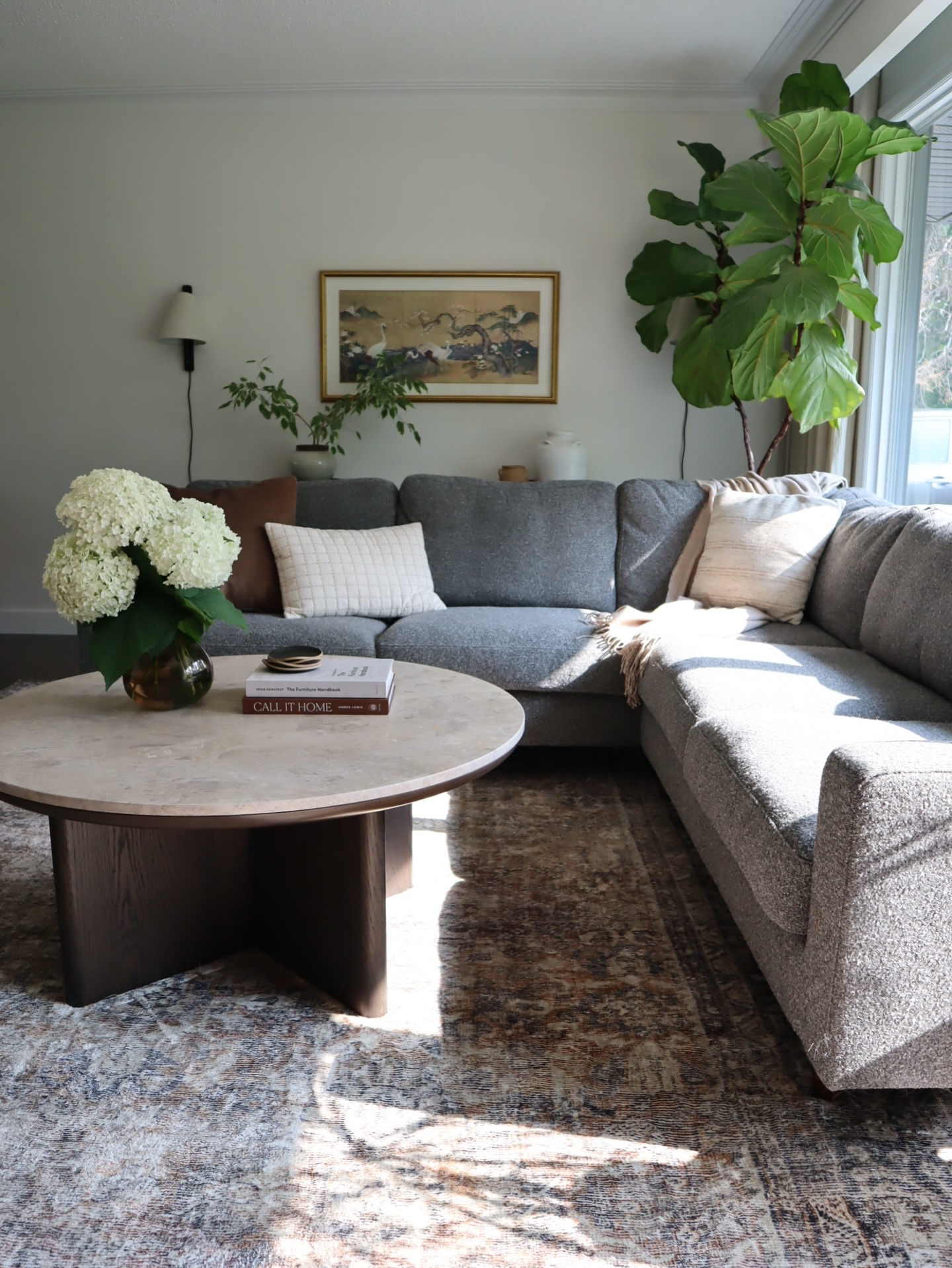 Balance a Low Gray Sectional with Tall Greenery