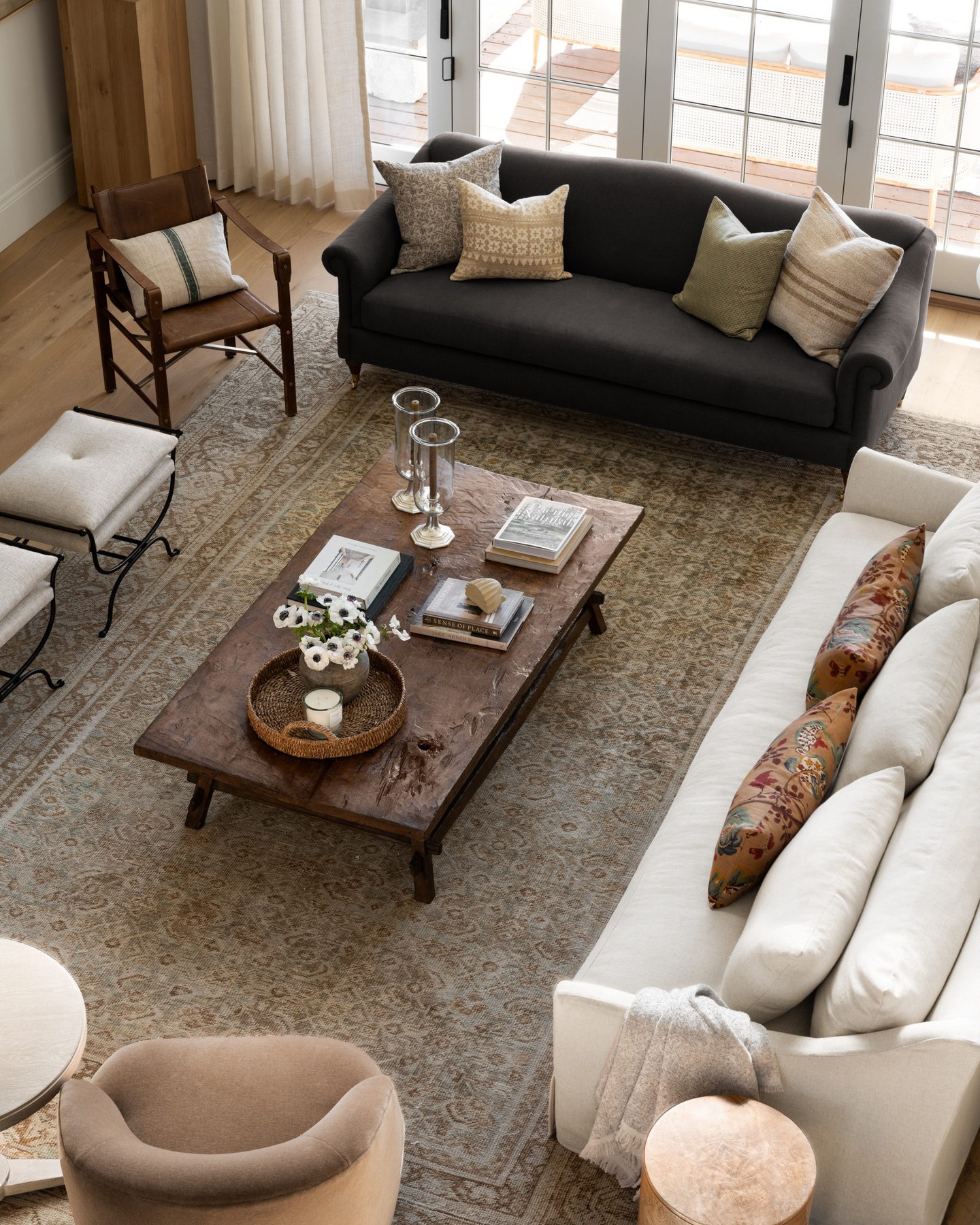 18. Unite Mixed Seating on a Muted Rug