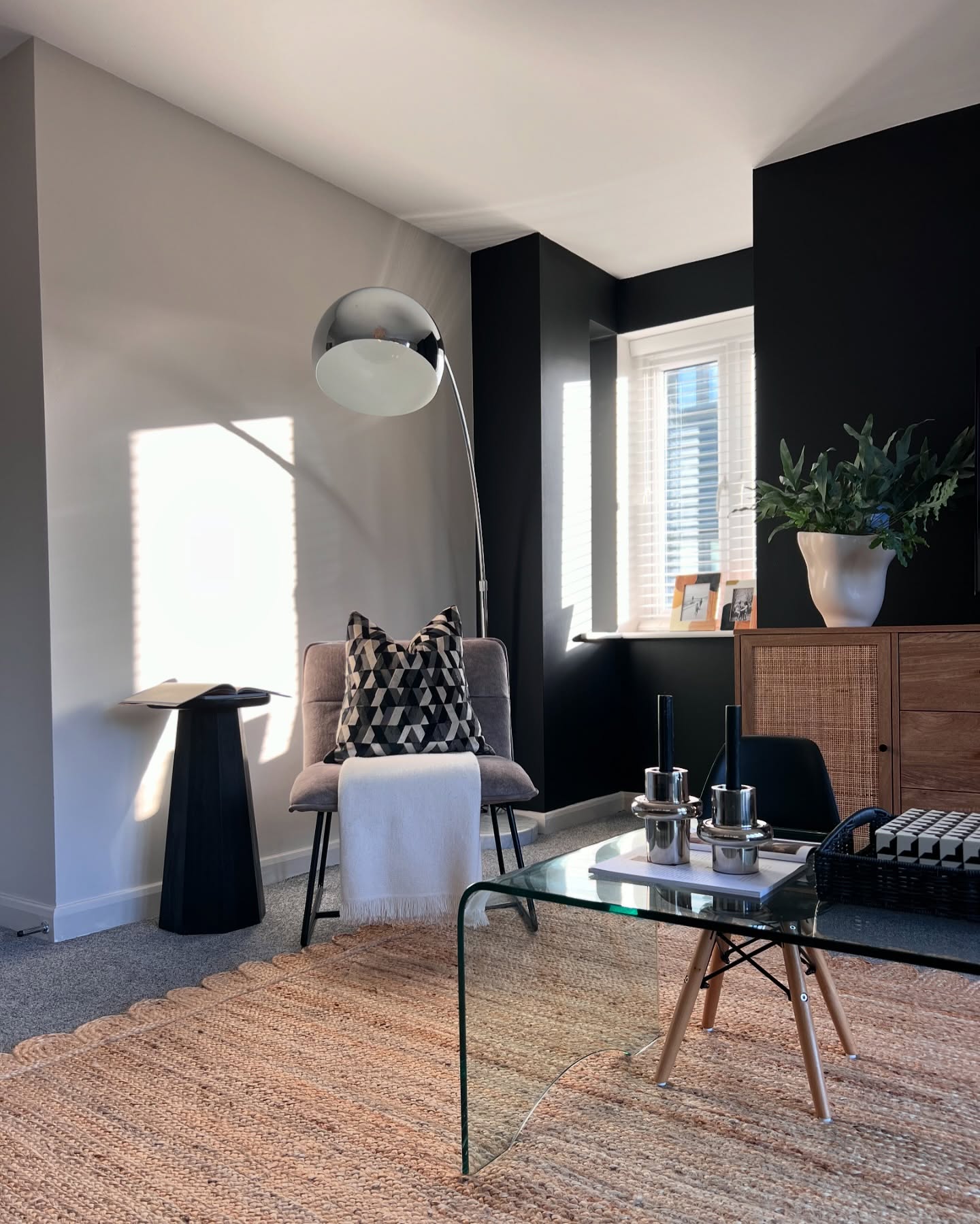 20. Warm a Black Feature Wall With Woven Textures