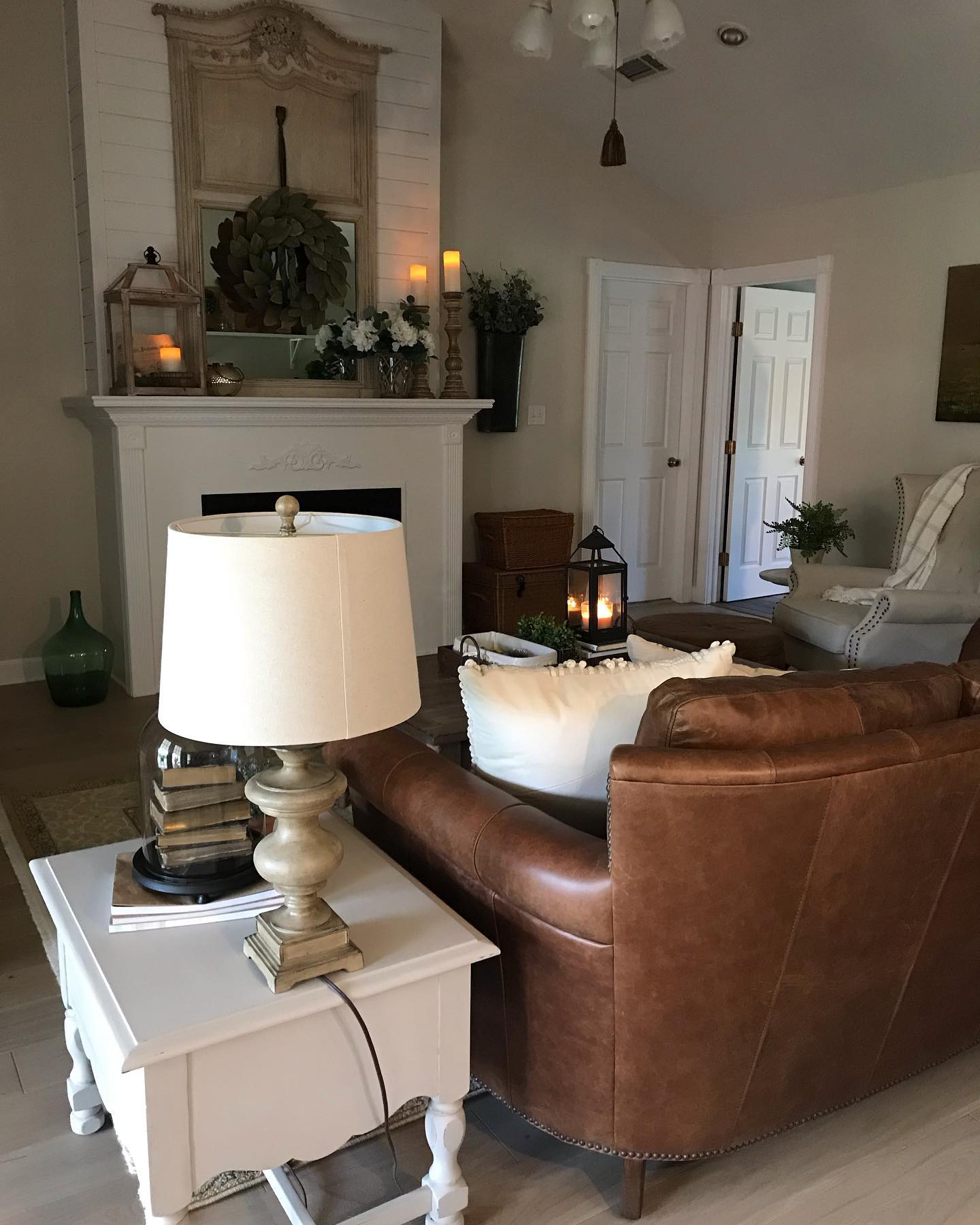 Soften a Brown Sofa With Pale Painted Tables