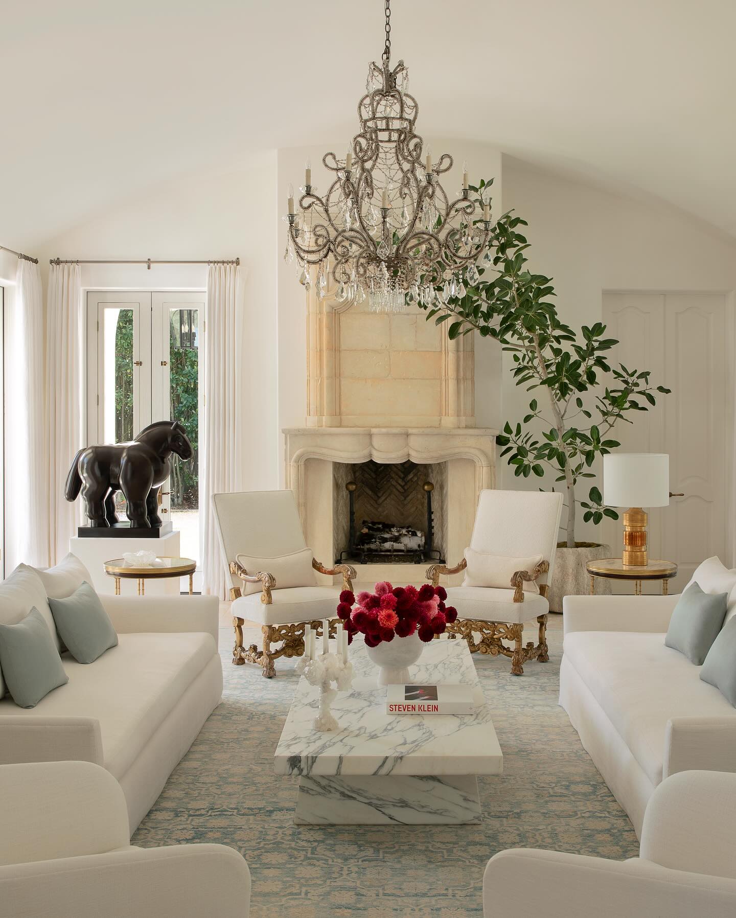6. Set Ornate Chairs Against Simple Cream Upholstery
