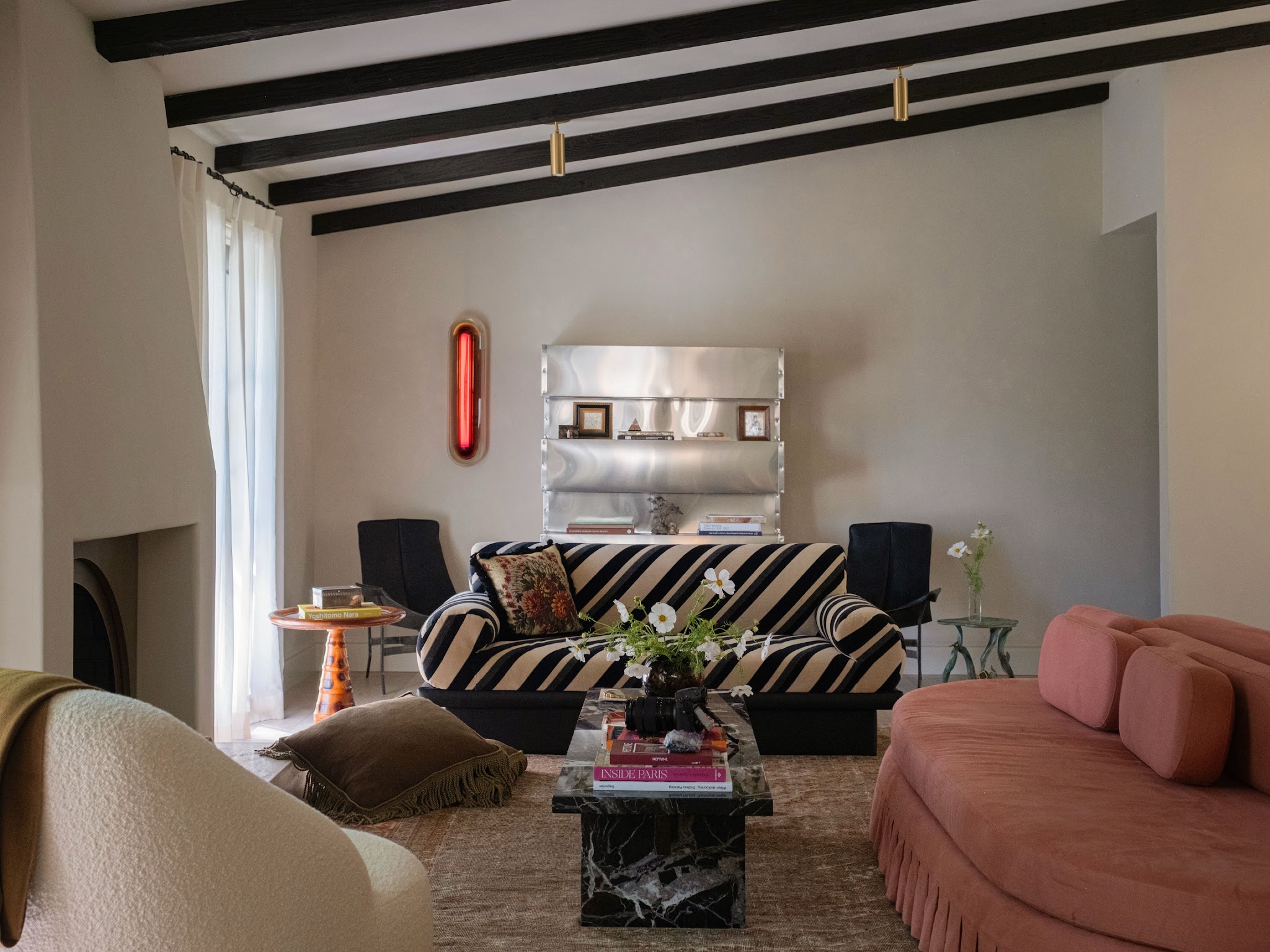 7. Echo Dark Ceiling Beams with a Striped Sofa