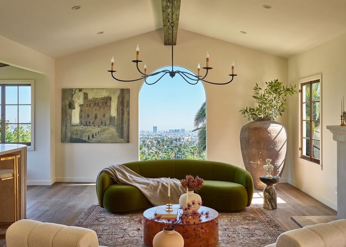 8. Echo an Arched Window with a Rounded Sofa