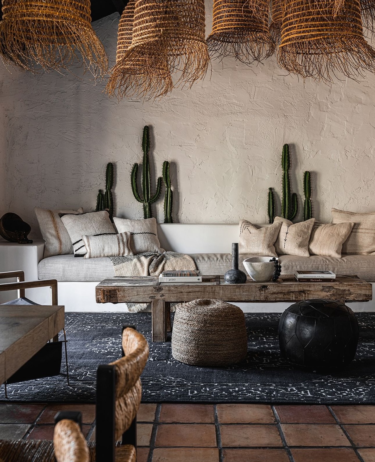 9. Leave Terracotta Tile Visible Around a Dark Rug