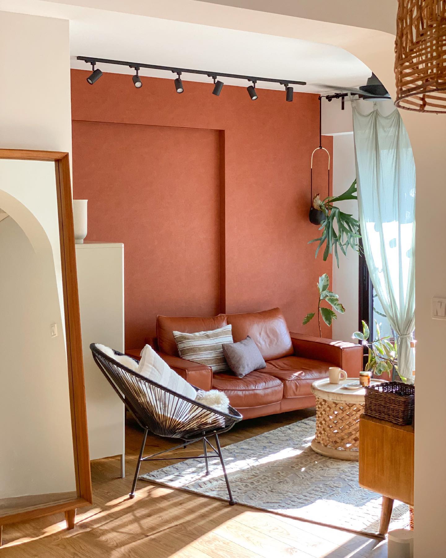 16. Warm a Small Seating Area with Terracotta Walls