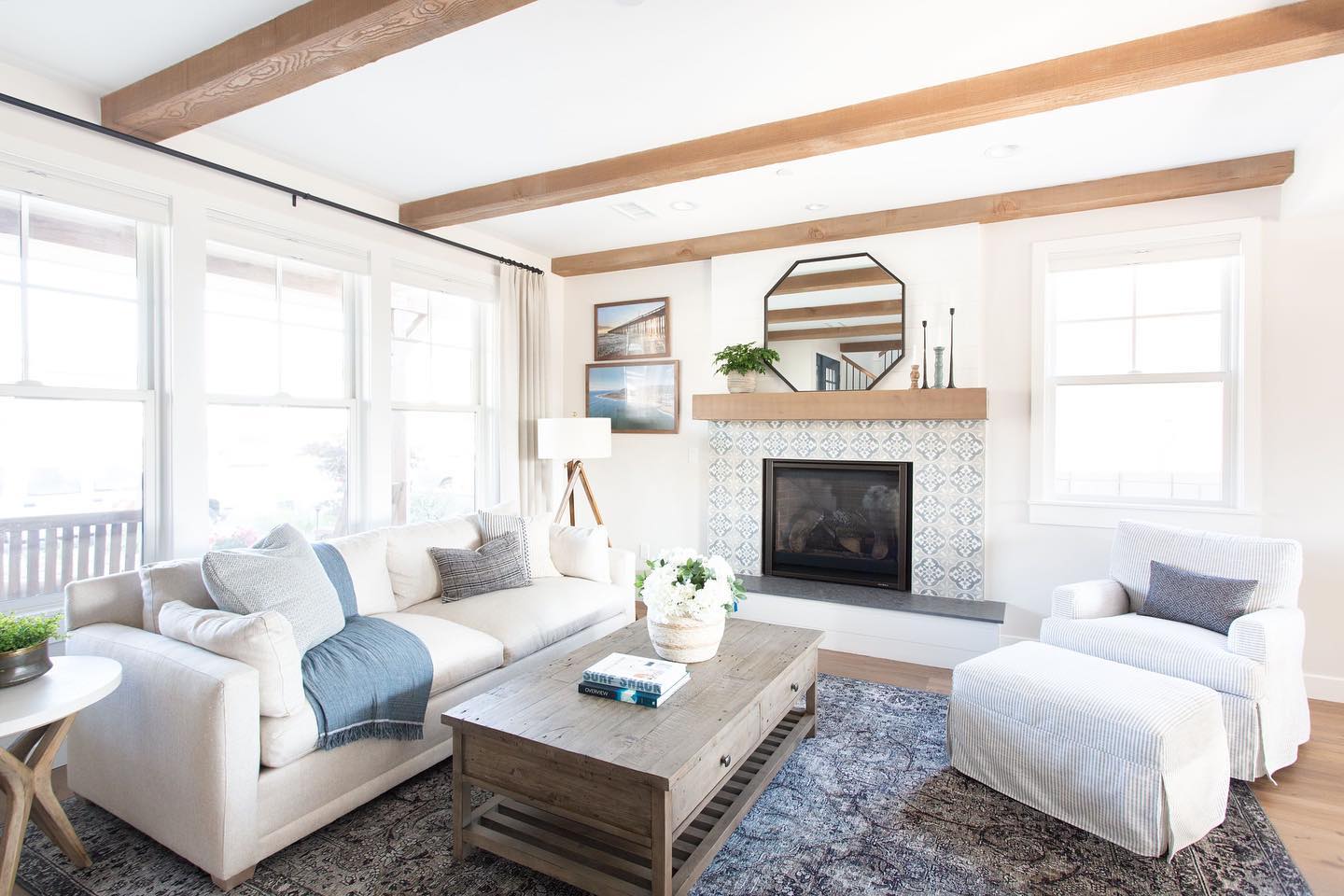 3. Layer pale blue textiles beneath exposed wood beams