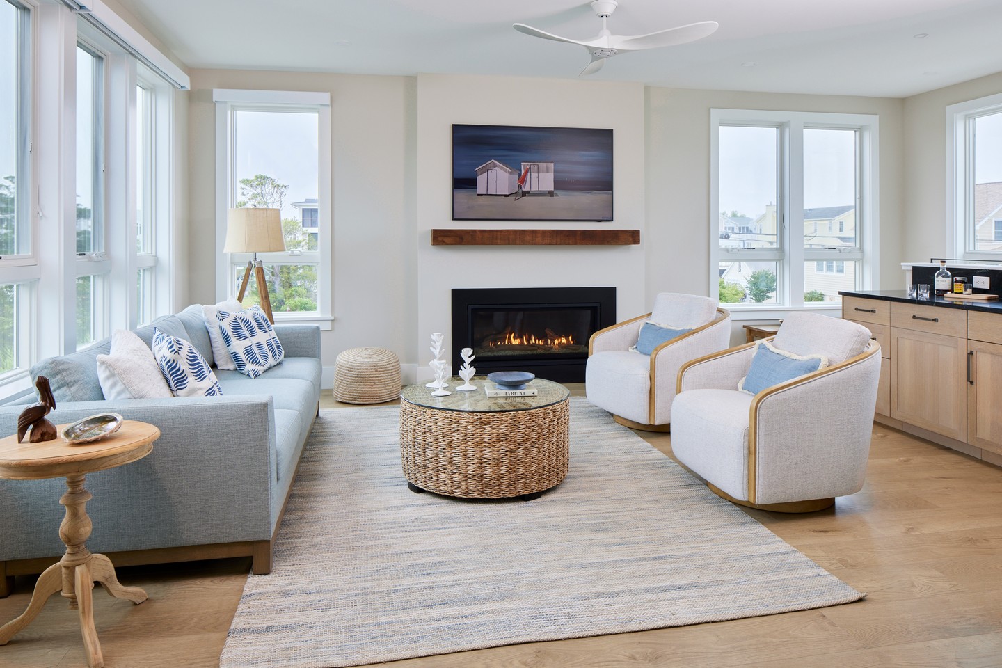 4. Frame a simple fireplace with airy windows and wicker