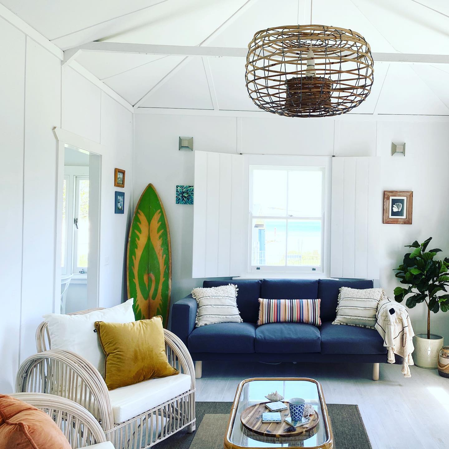 19. Anchor a white beach room with a navy sofa