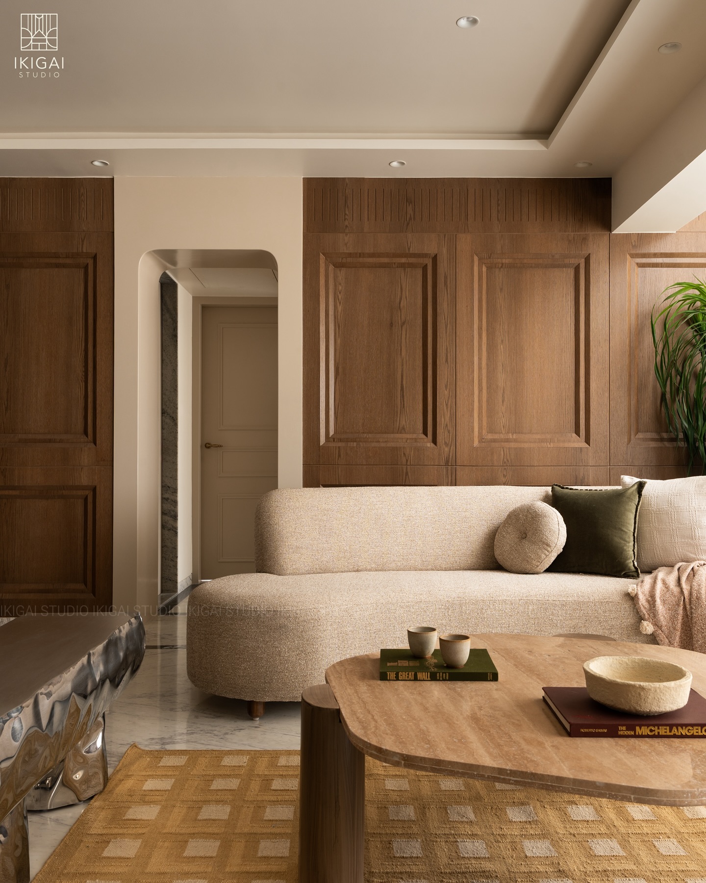 2. Balance Paneled Walls With a Curved Sofa